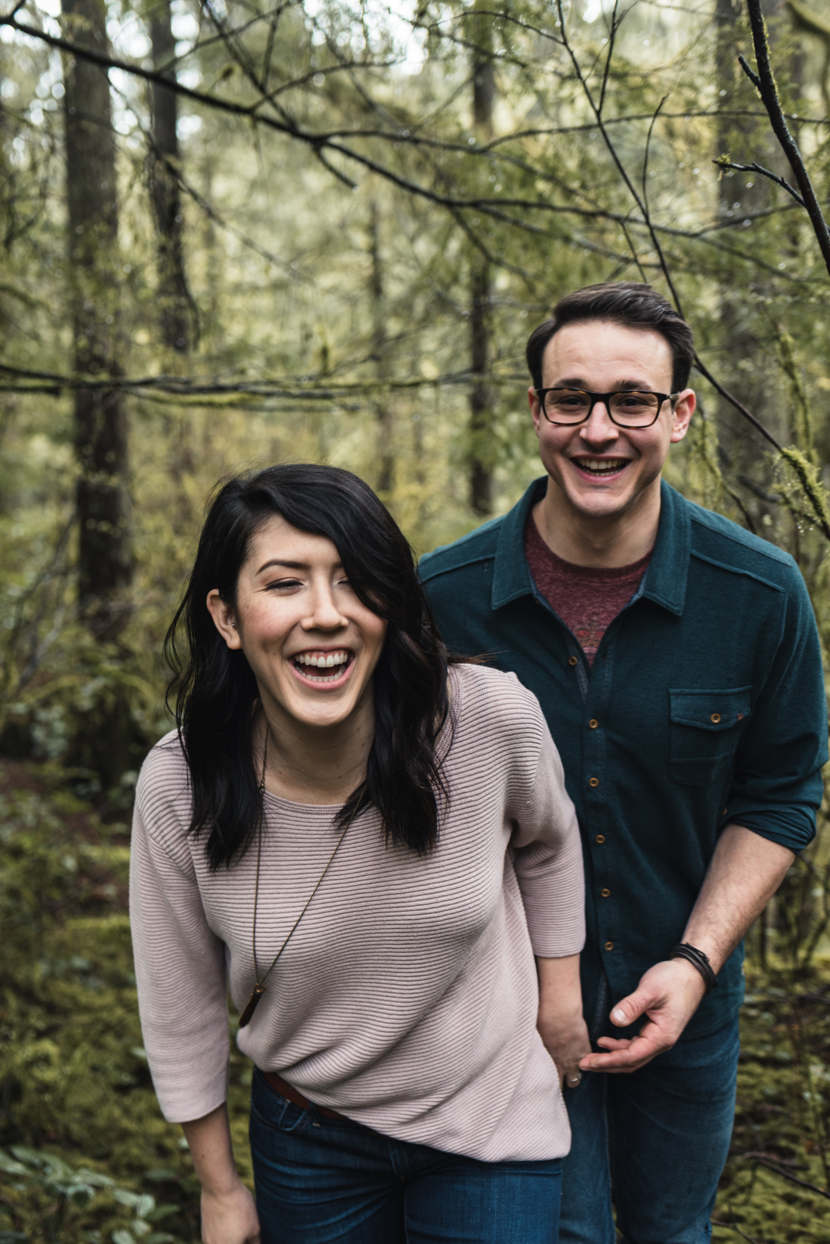 Couple walking through forest