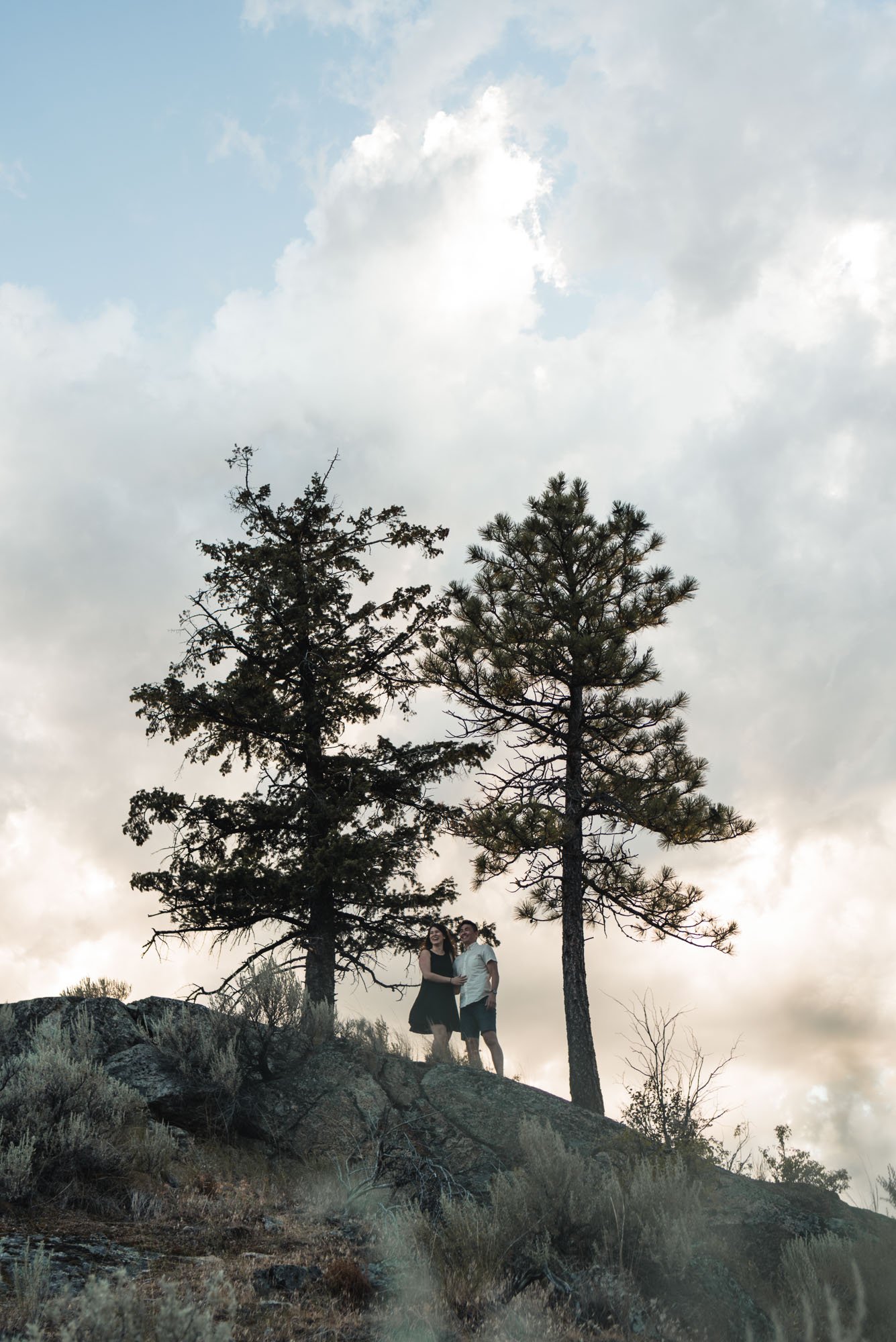 Couple poses with trees on Anarchist Mountain, Osoyoos