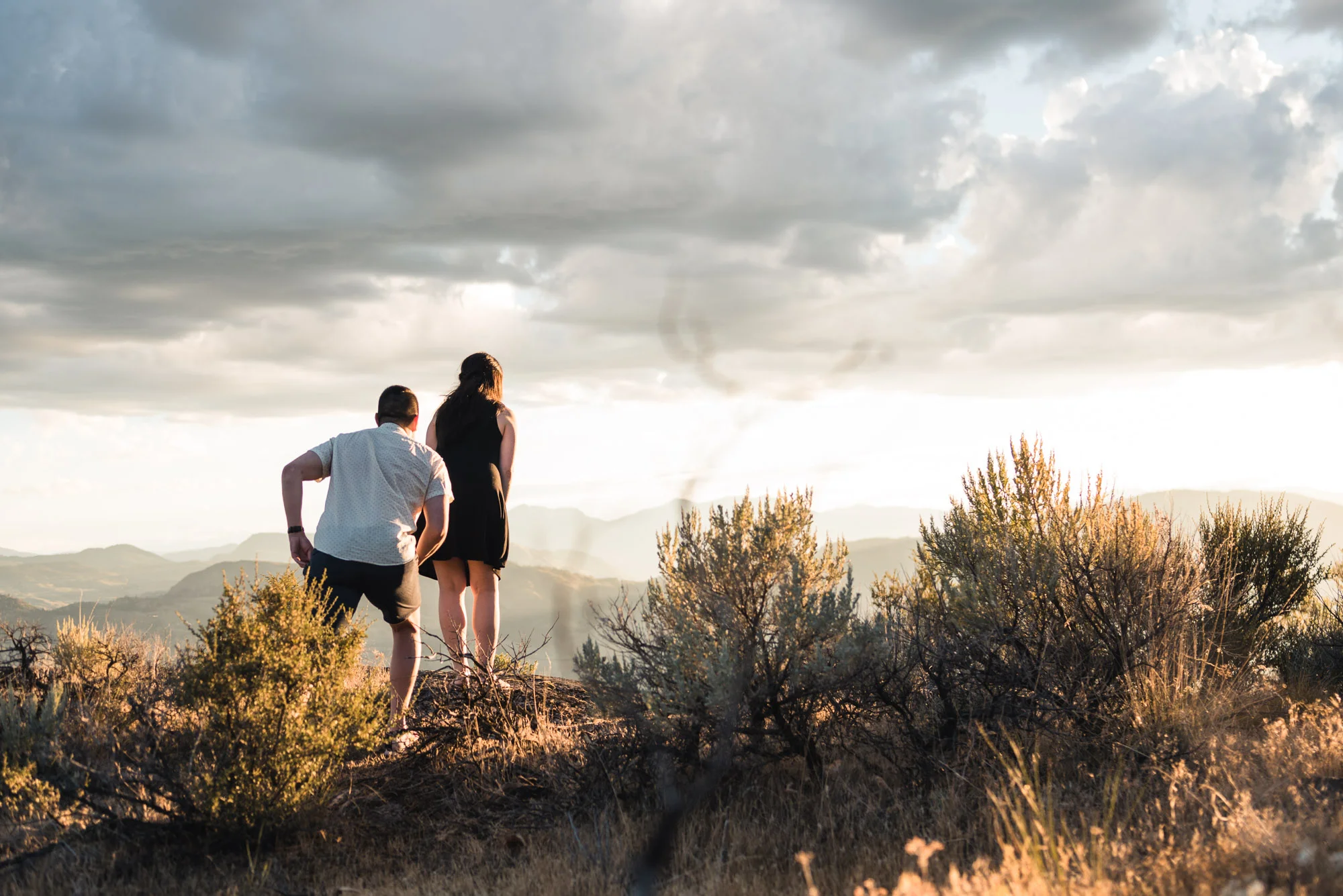 Man proposes with sunset on Anarchist Mountain, Osoyoos