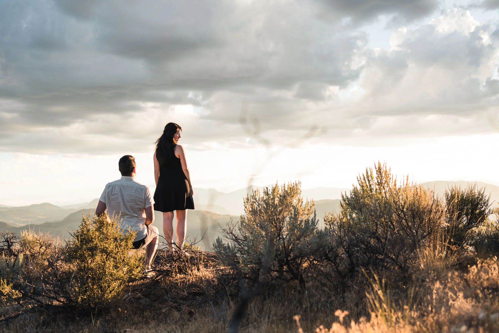 Man proposes with sunset on Anarchist Mountain, Osoyoos