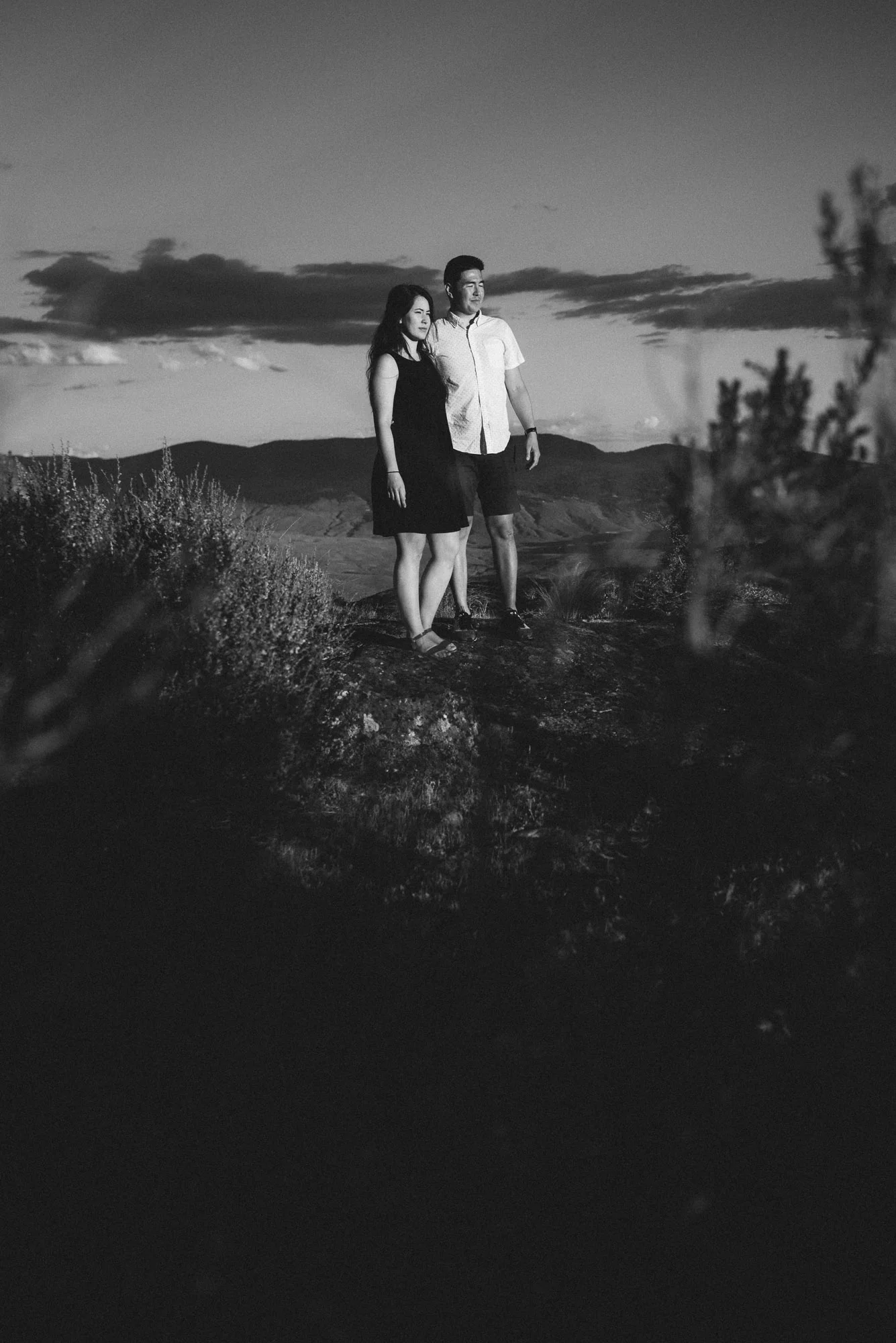 Engaged couple poses with sunset on Anarchist Mountain, Osoyoos