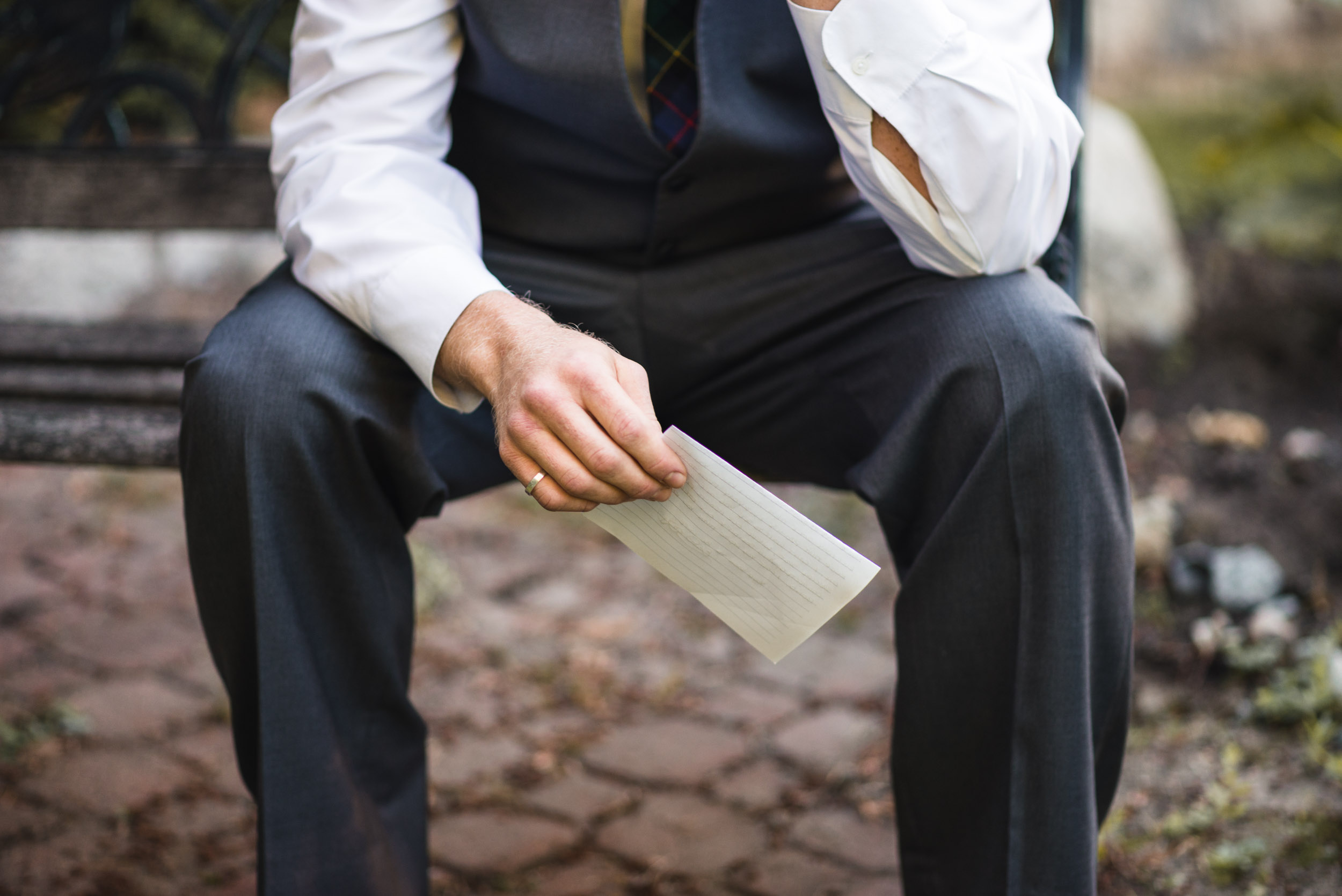 Groom holding letter