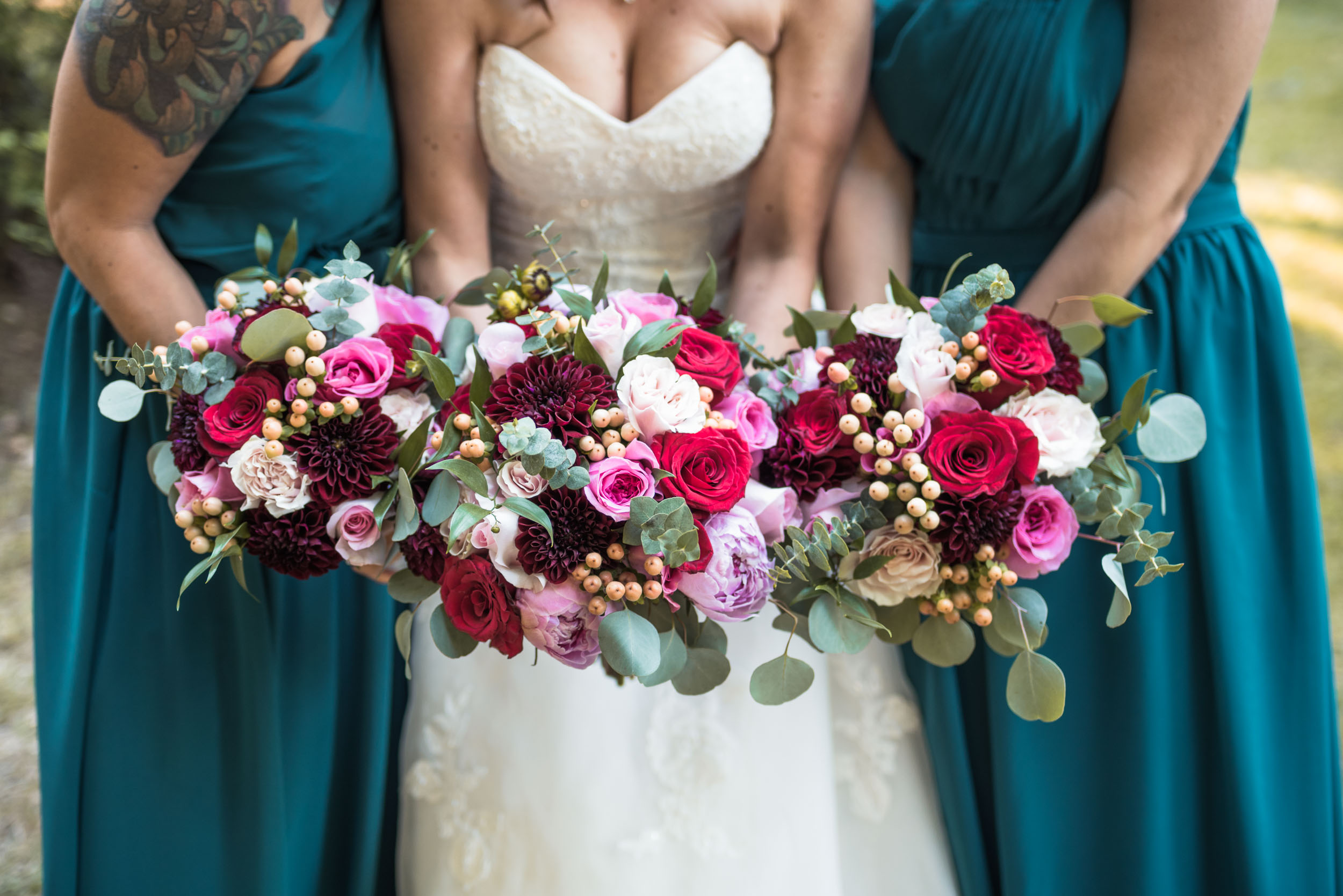 Bride and bridesmaids with flower bouquets