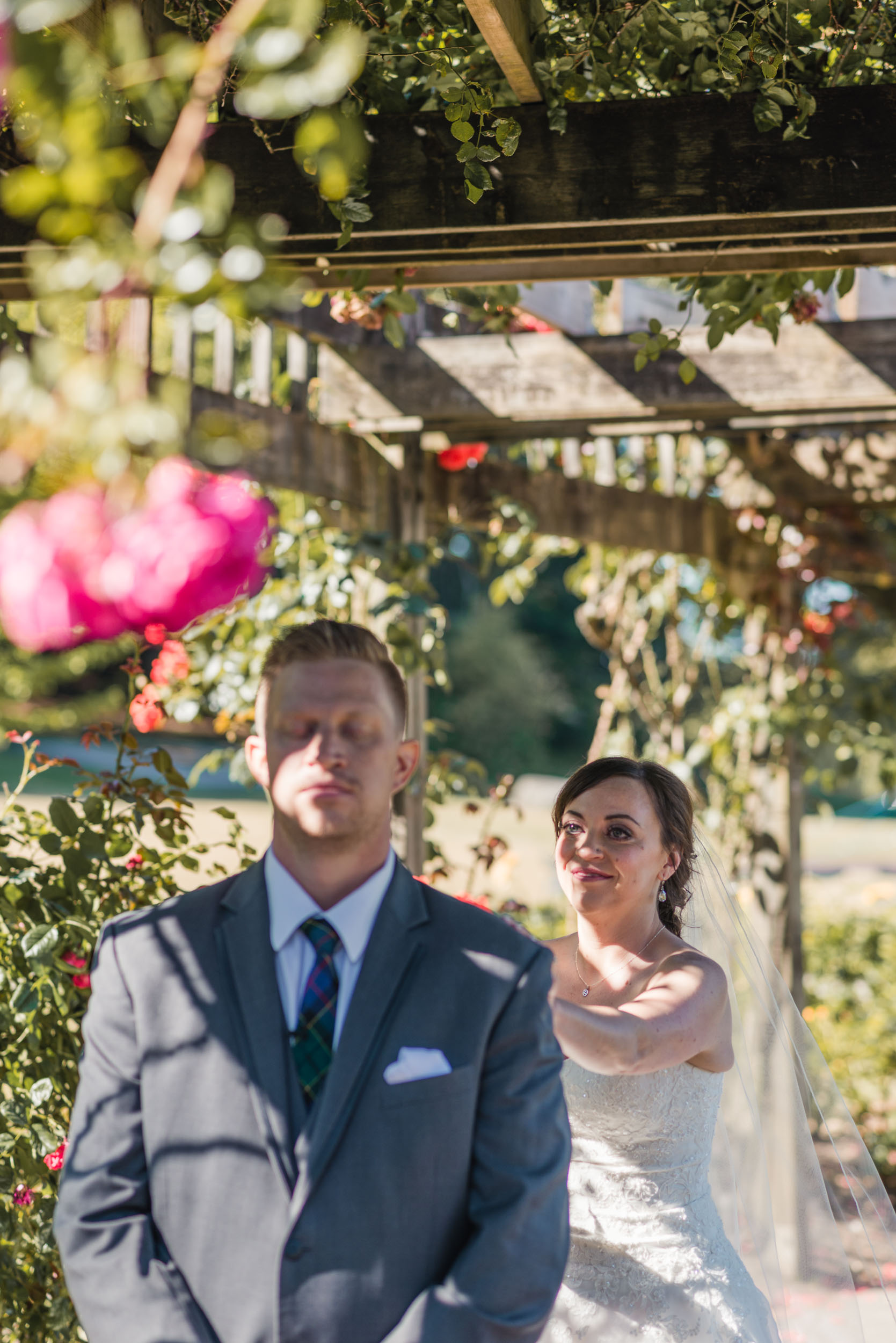 First look Bride and Groom in rose garden