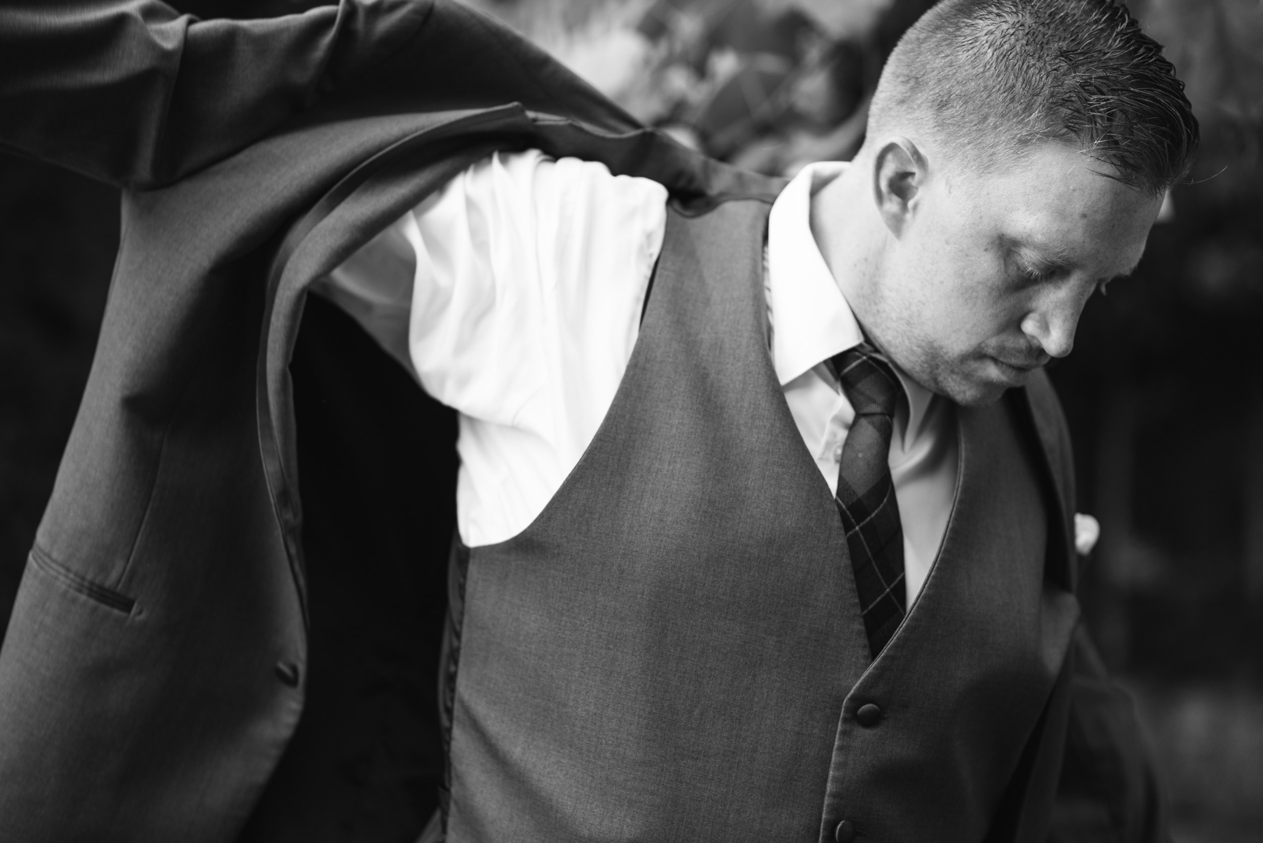 Groom getting dressed