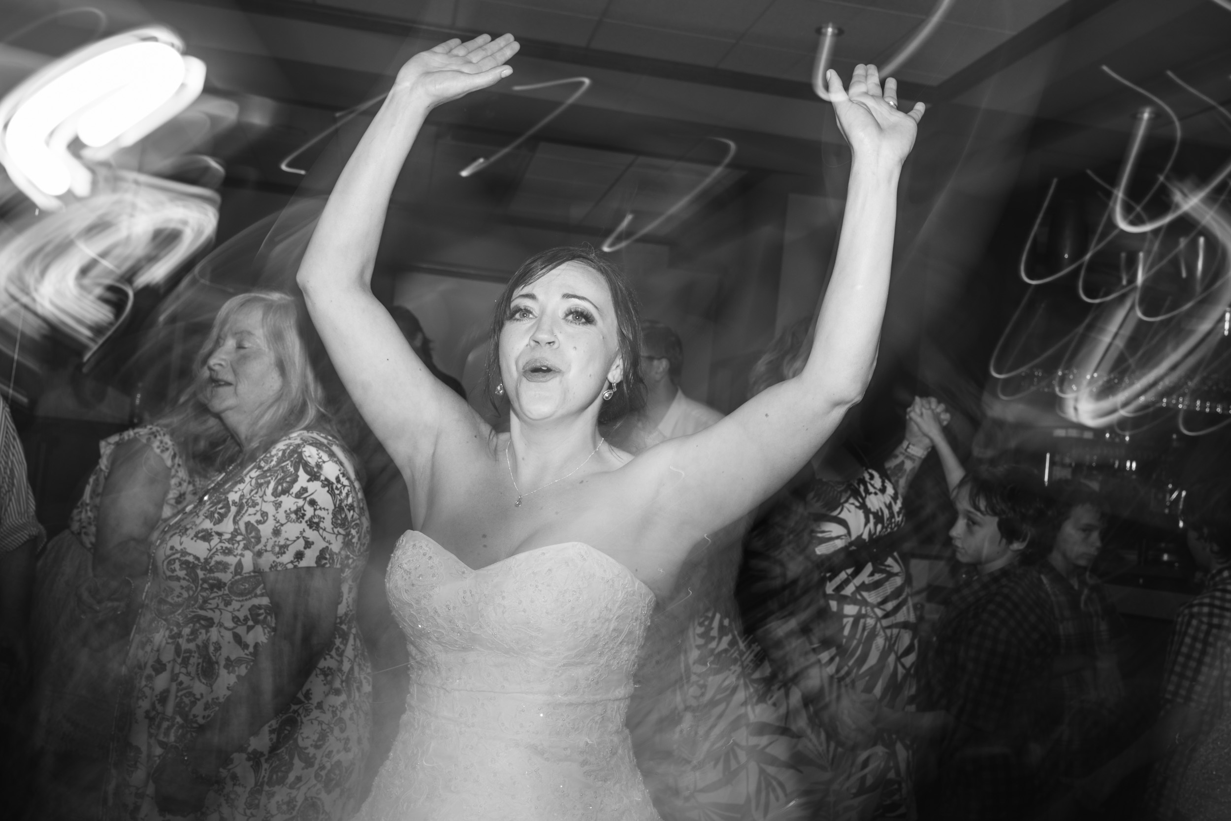 Bride dancing with lights