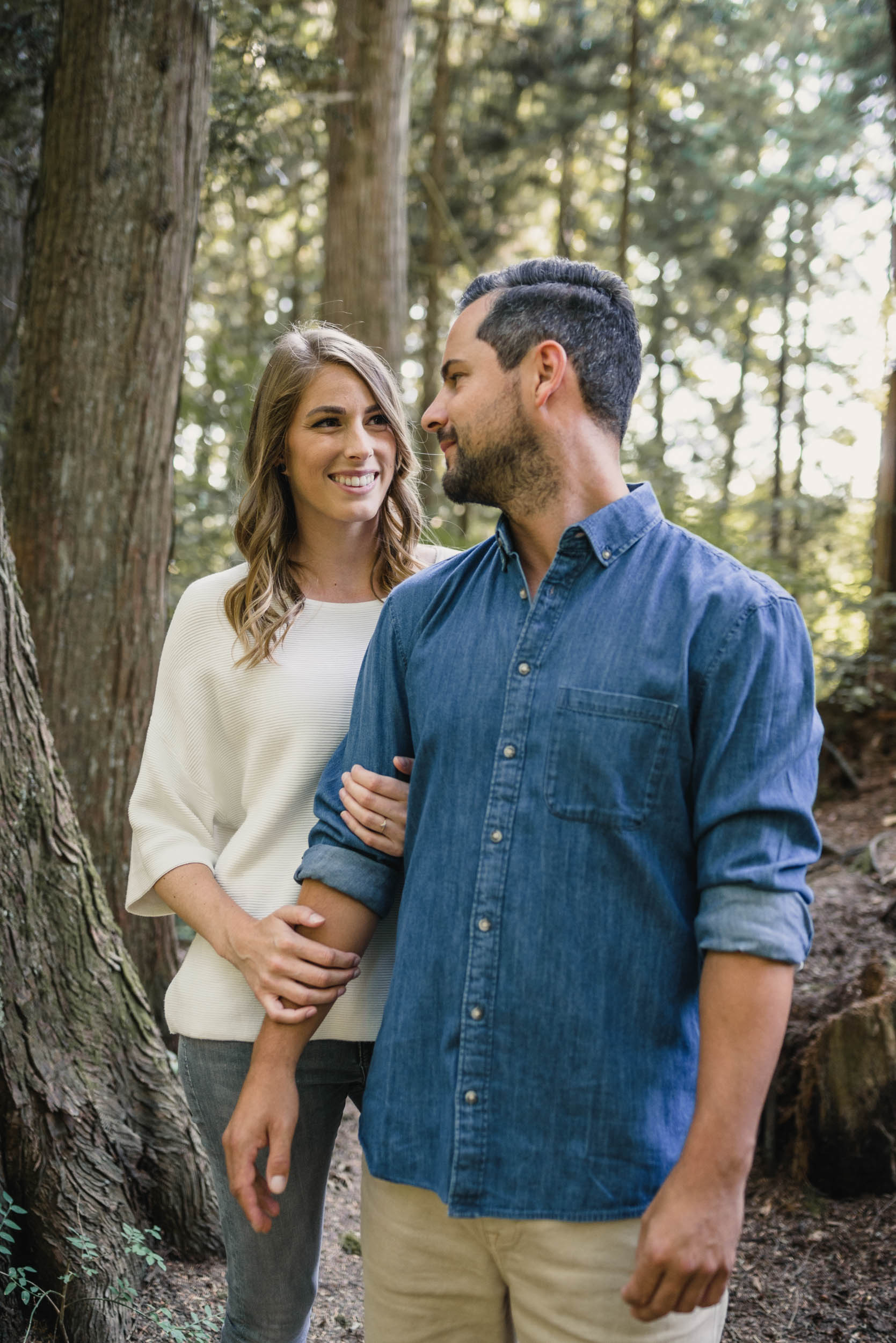 Couple hugs in the forest