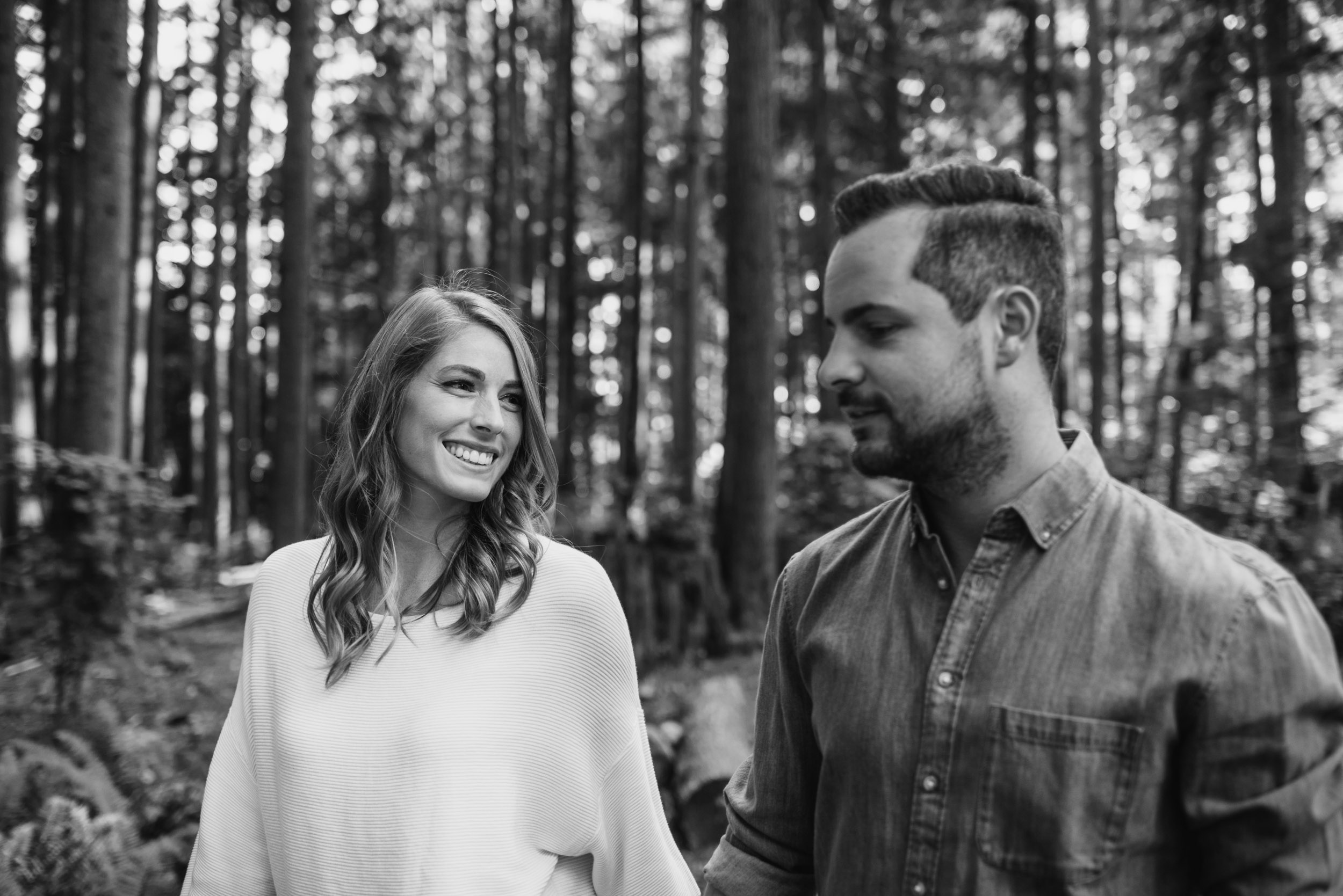 Couple walks through the forest together