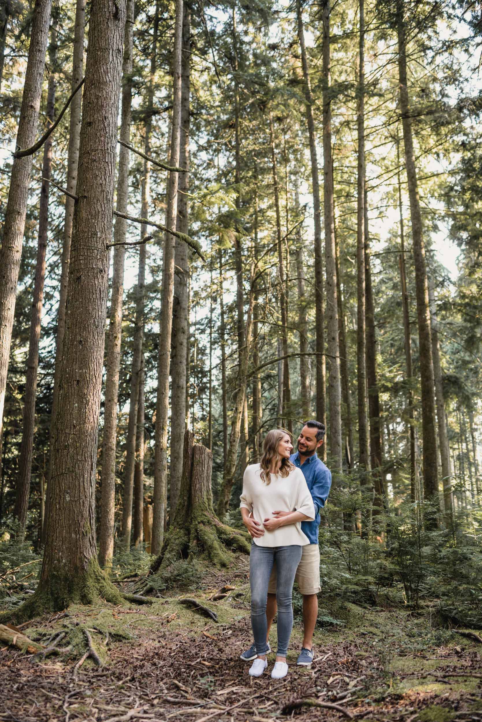 Couple embraces in the forest