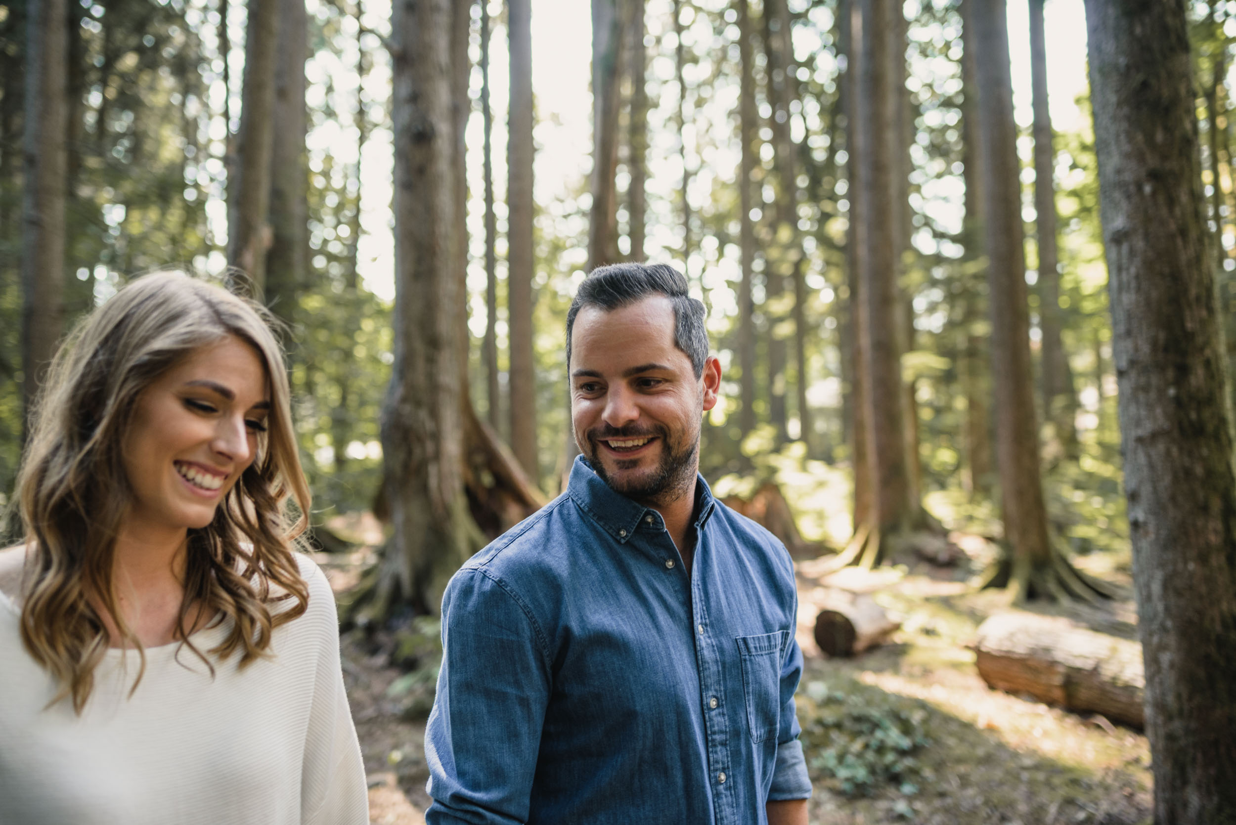 Couple walks through the forest together