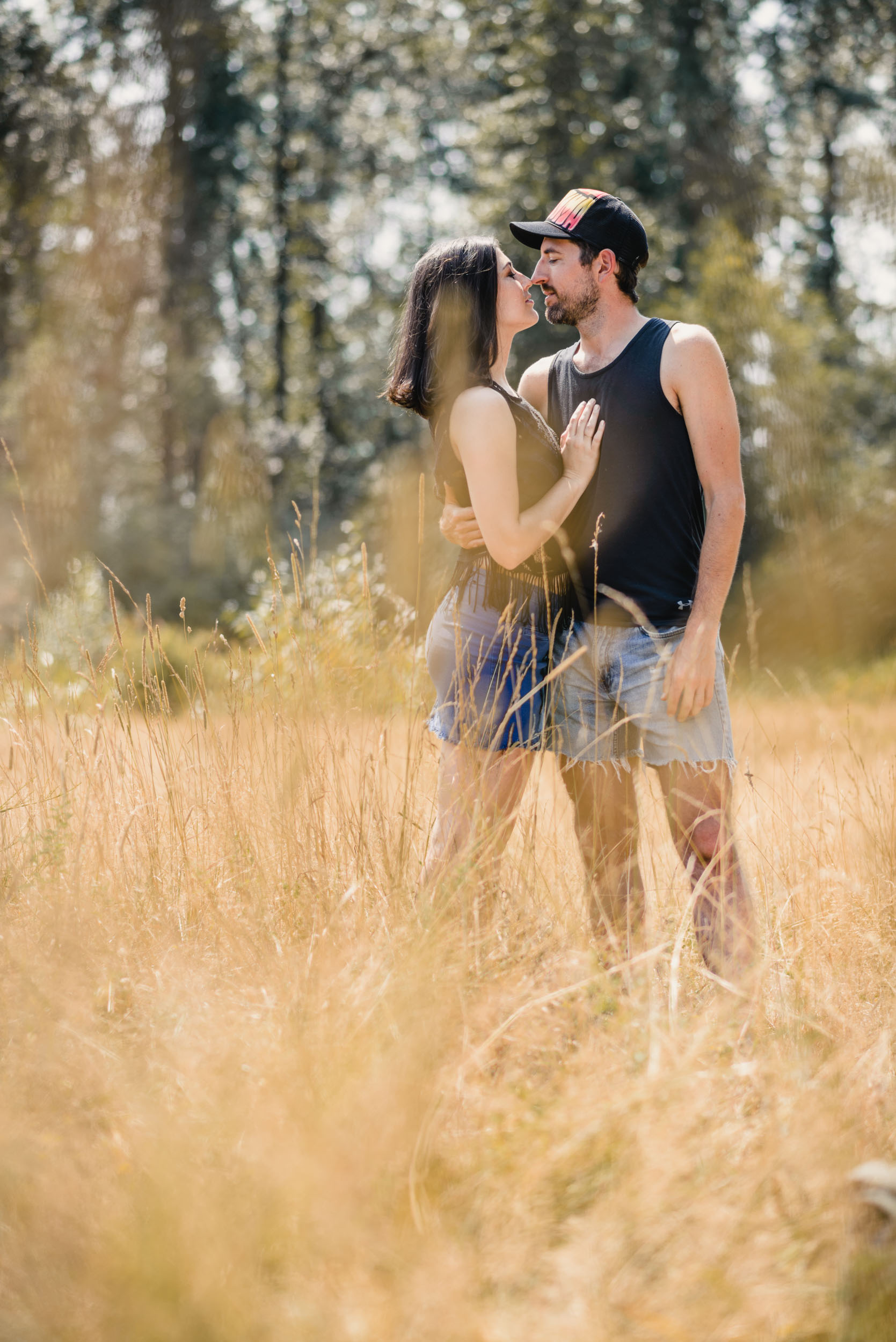 Couple hugging in field