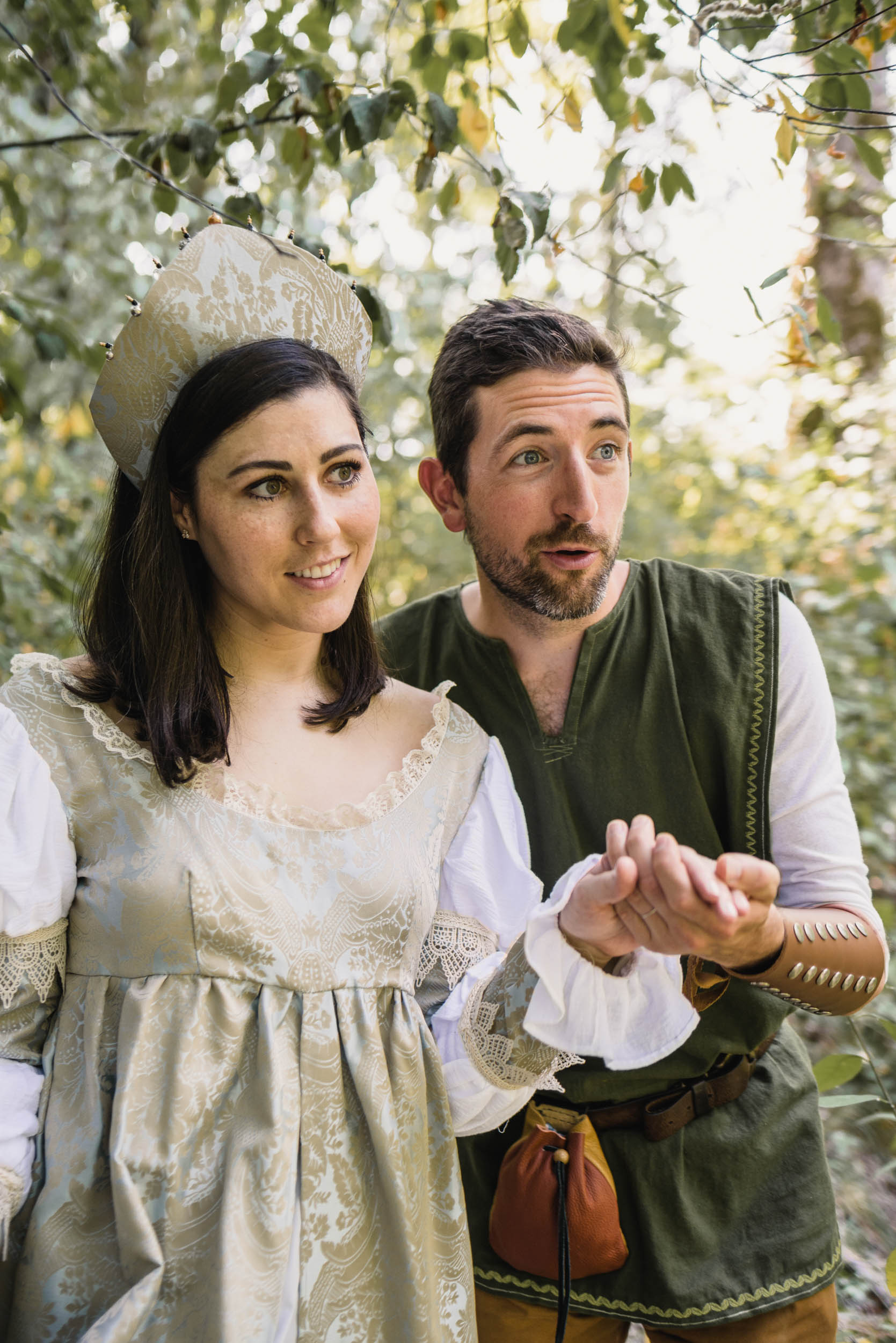 Couple with medieval costumes in forest