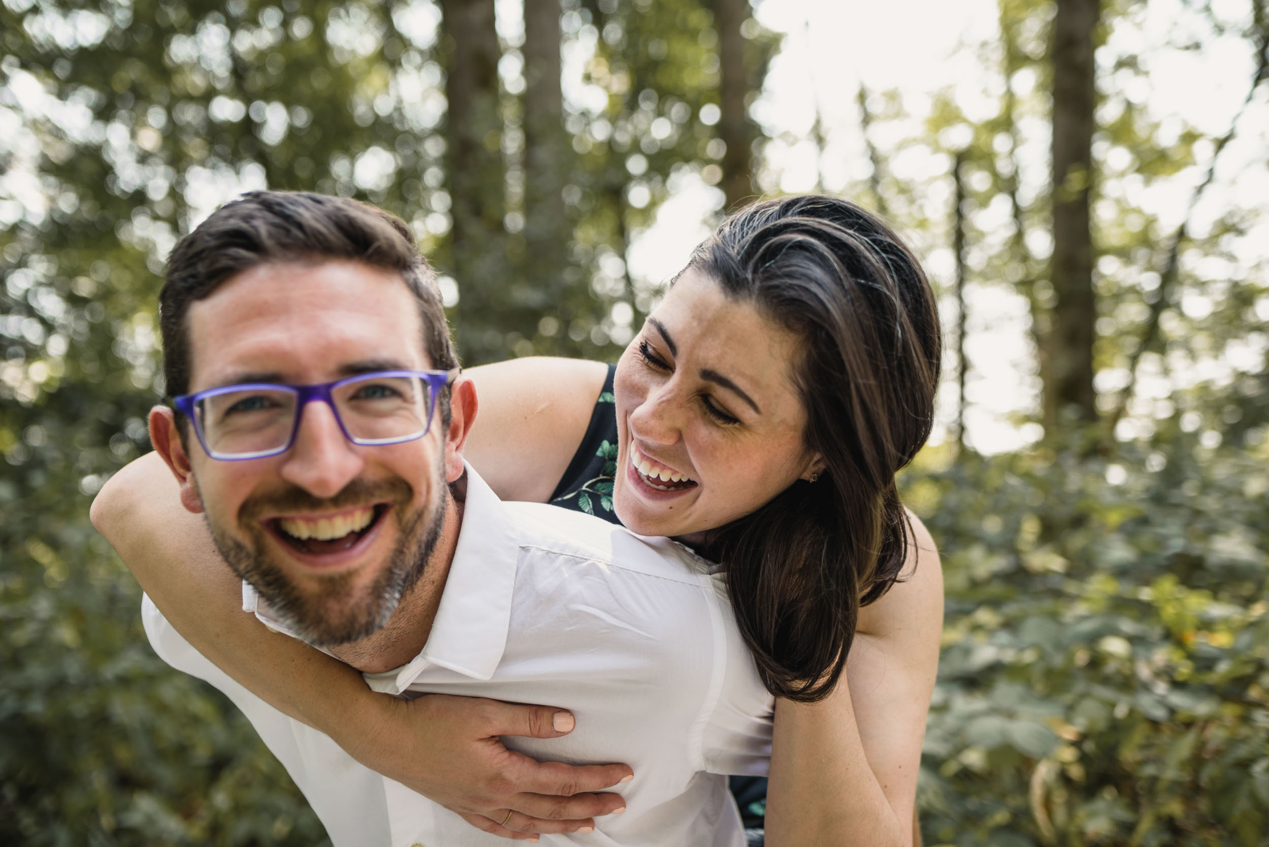 Piggy back and smiling in forest