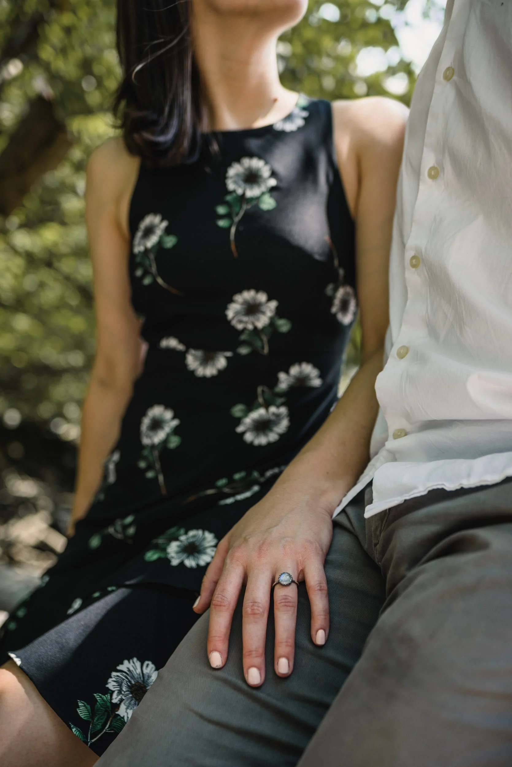 Engagement ring closeup hand on thigh