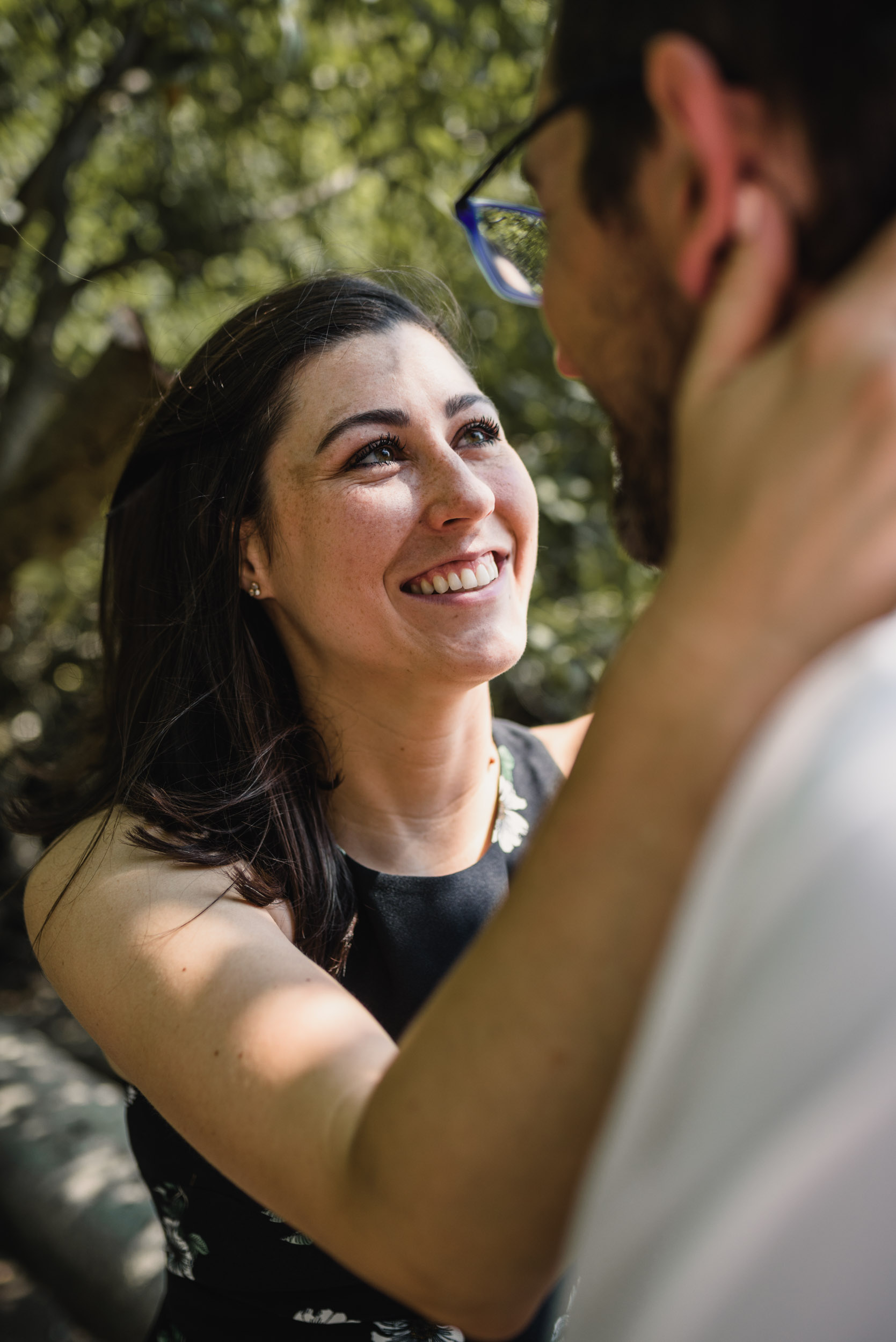 Smiling woman embracing fiancee