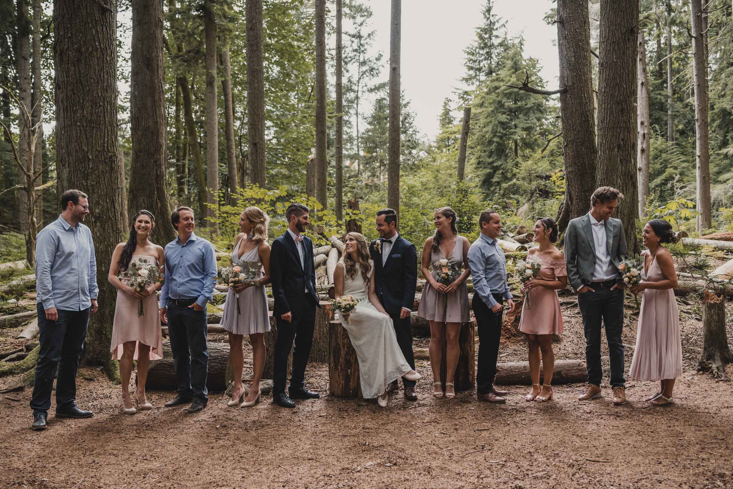 Wedding party group photo in forest