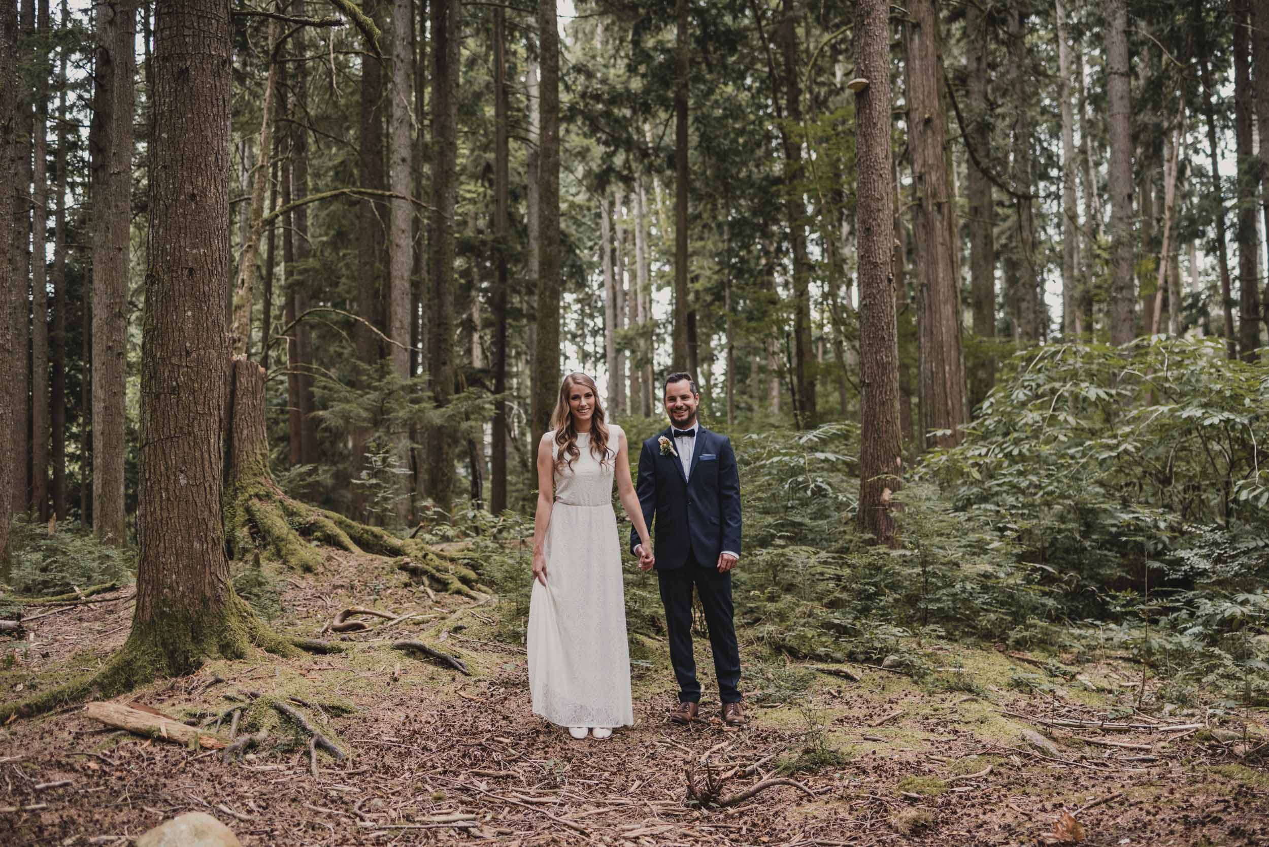 Bride and Groom side by side in forest