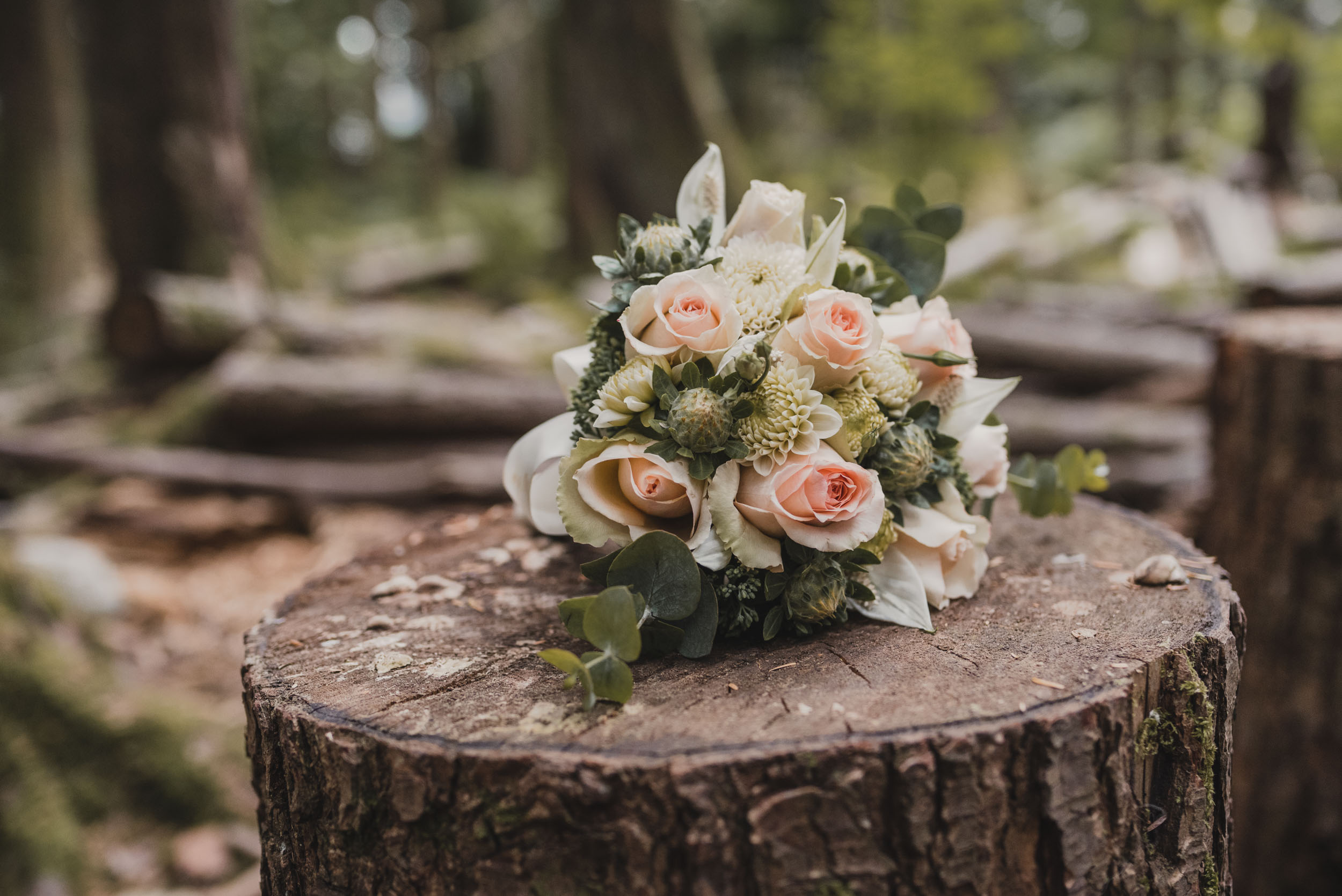 Bridal bouquet on log