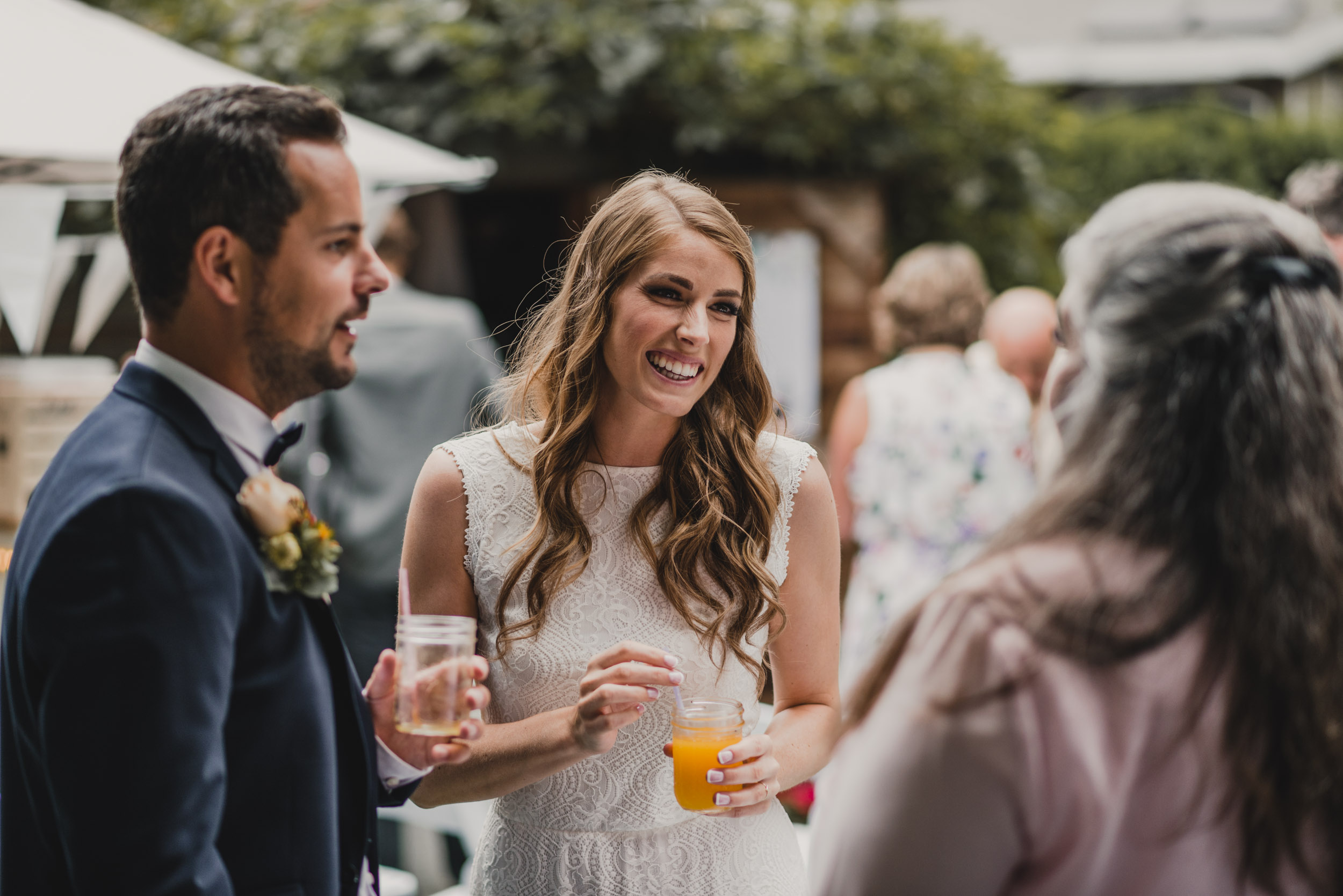 Bride and Groom talking with guests at reception