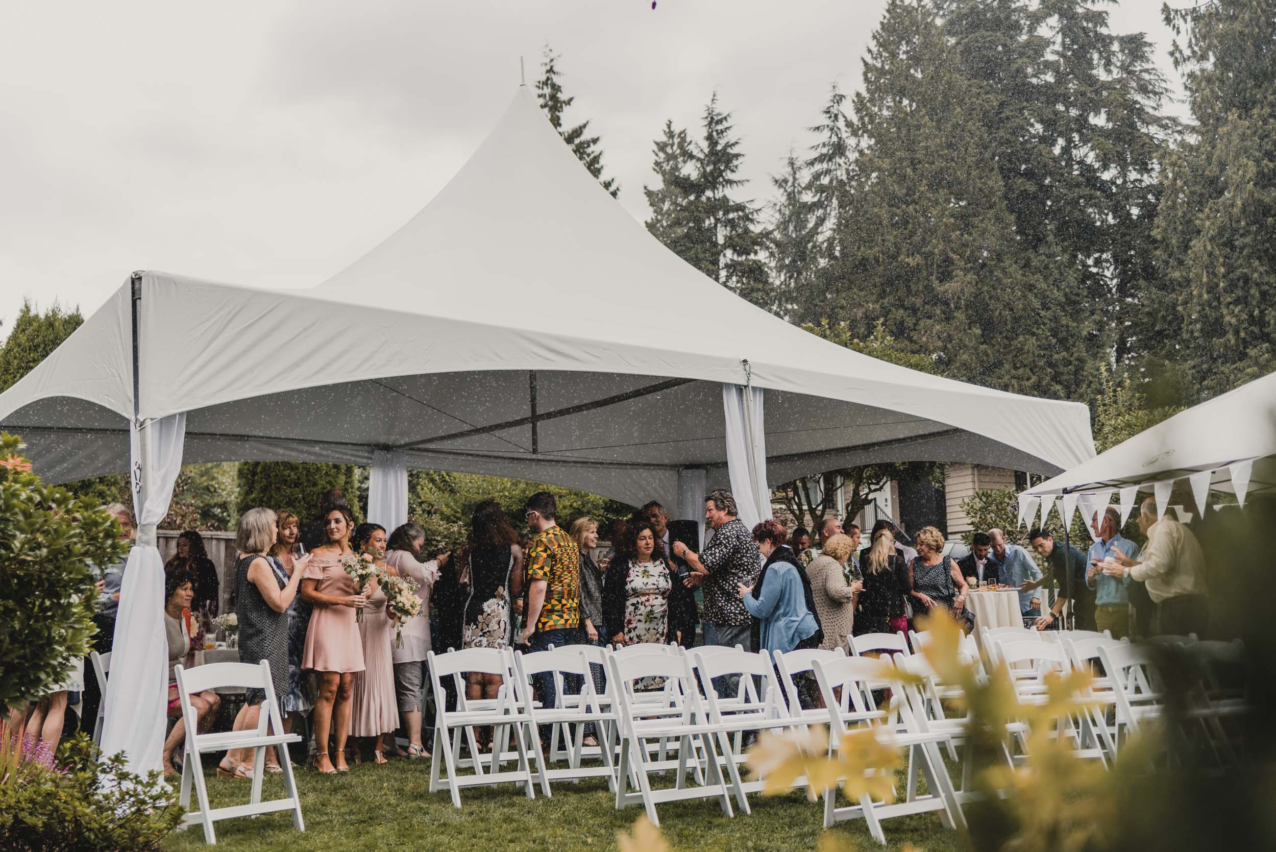 Wedding guests hiding from rain