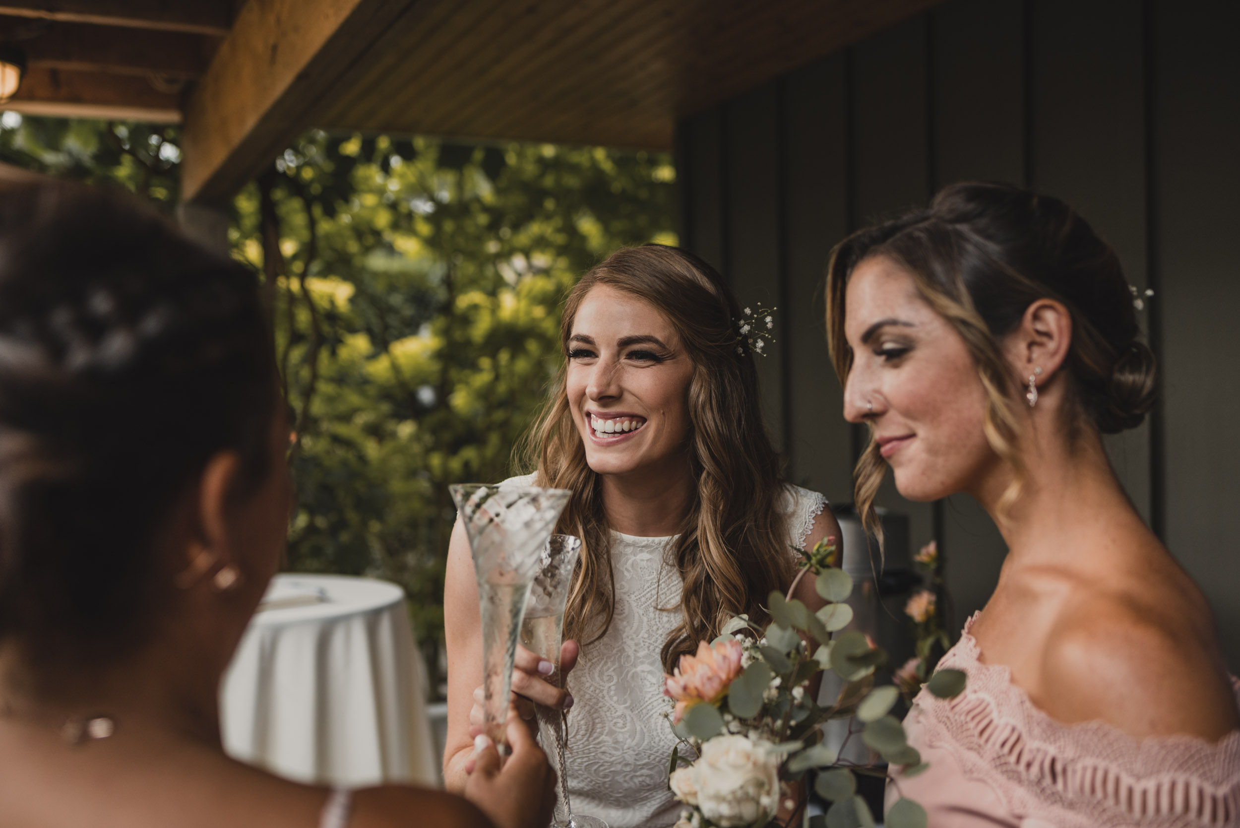 Bride laughs with friends