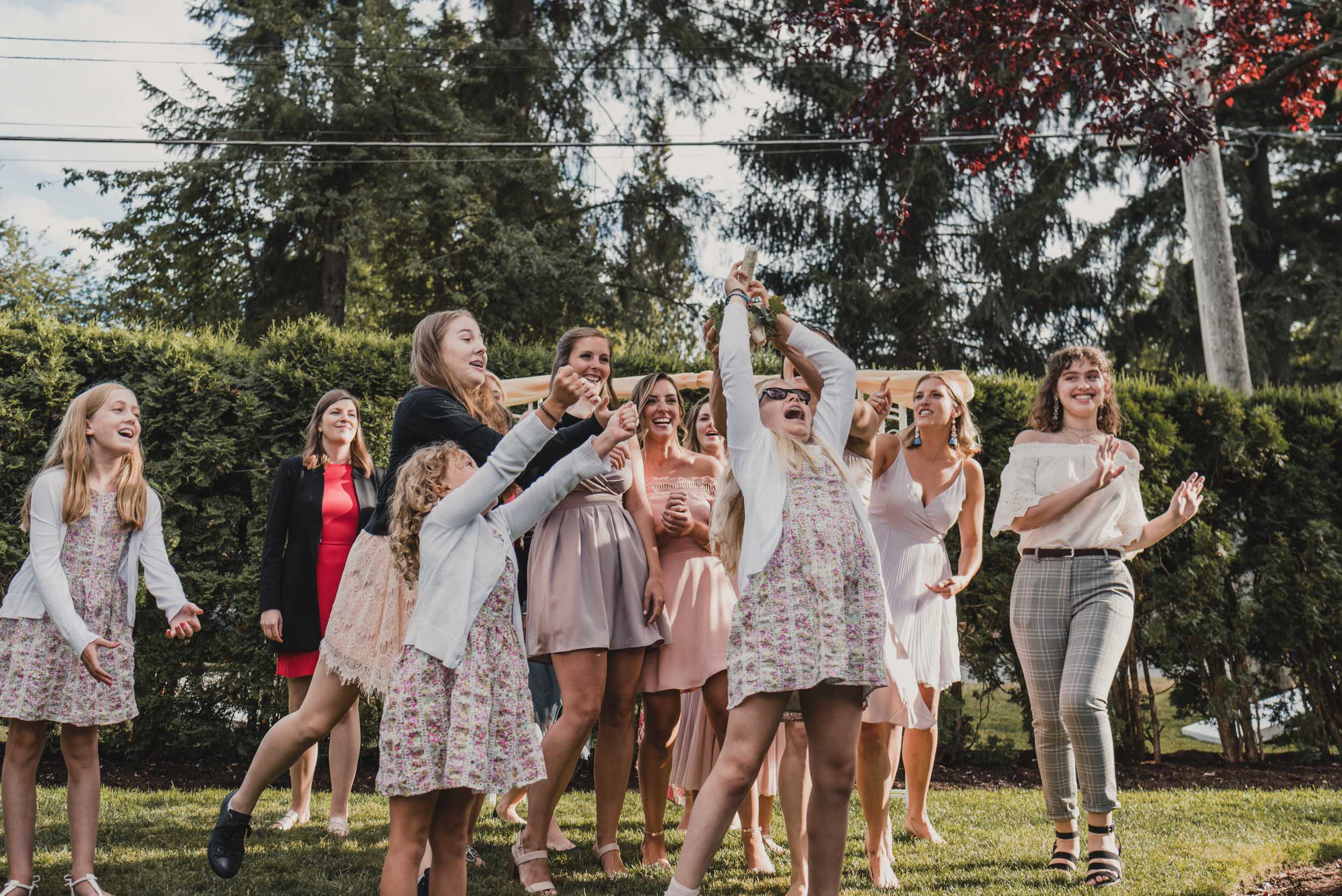 Young guest catches bouquet