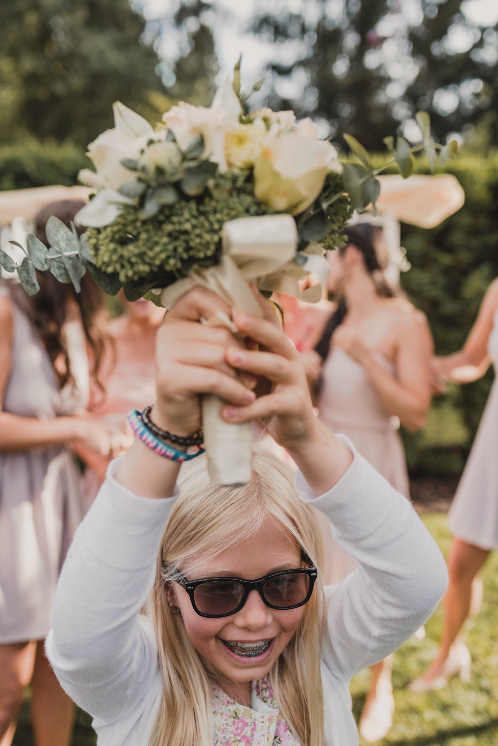 Young guest catches bouquet
