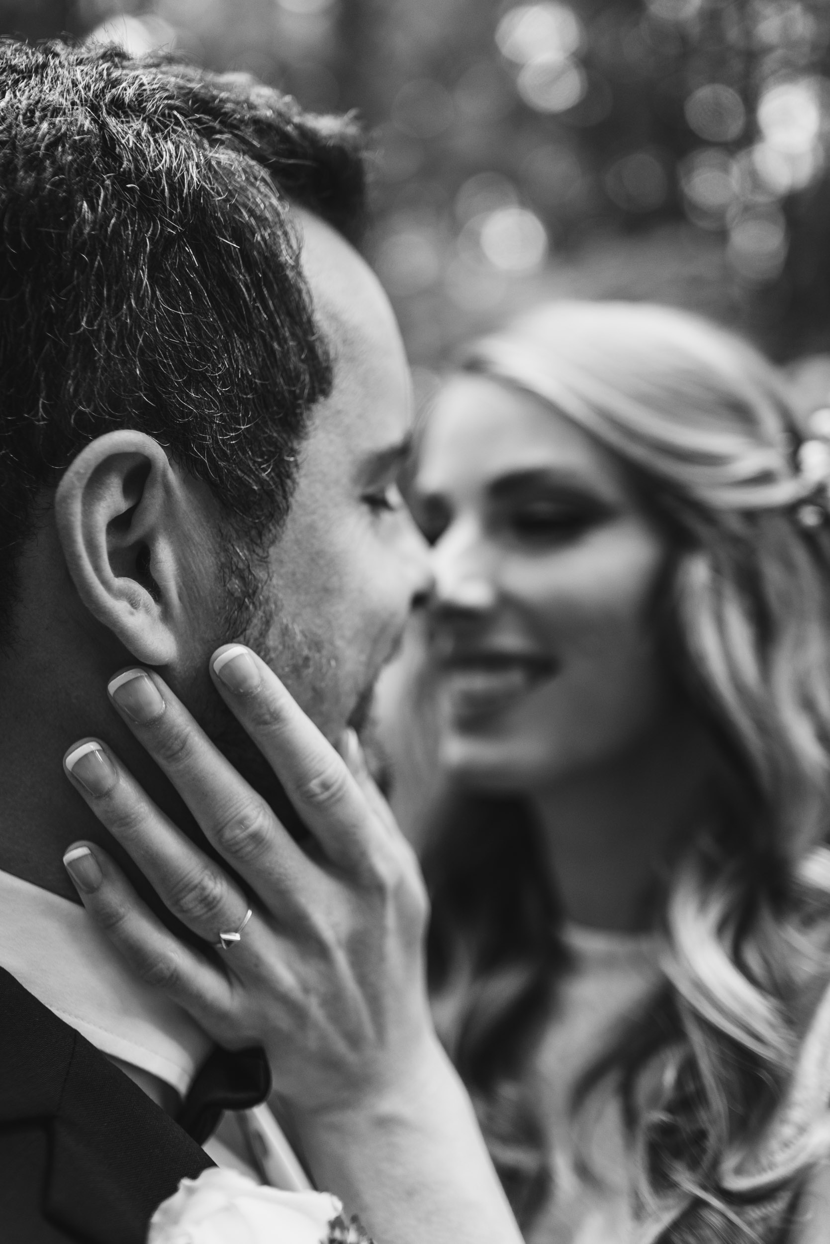 Bride's hand on Groom's cheek