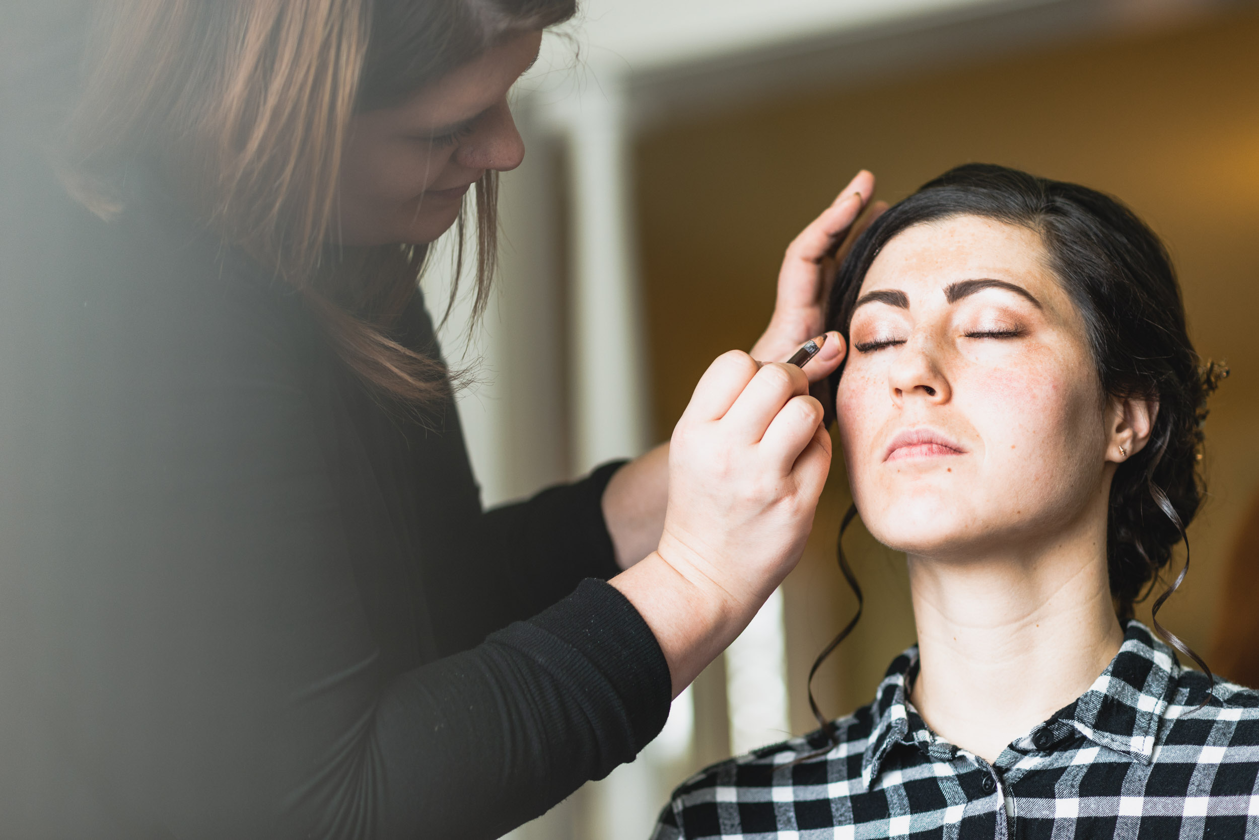 Bride getting makeup done