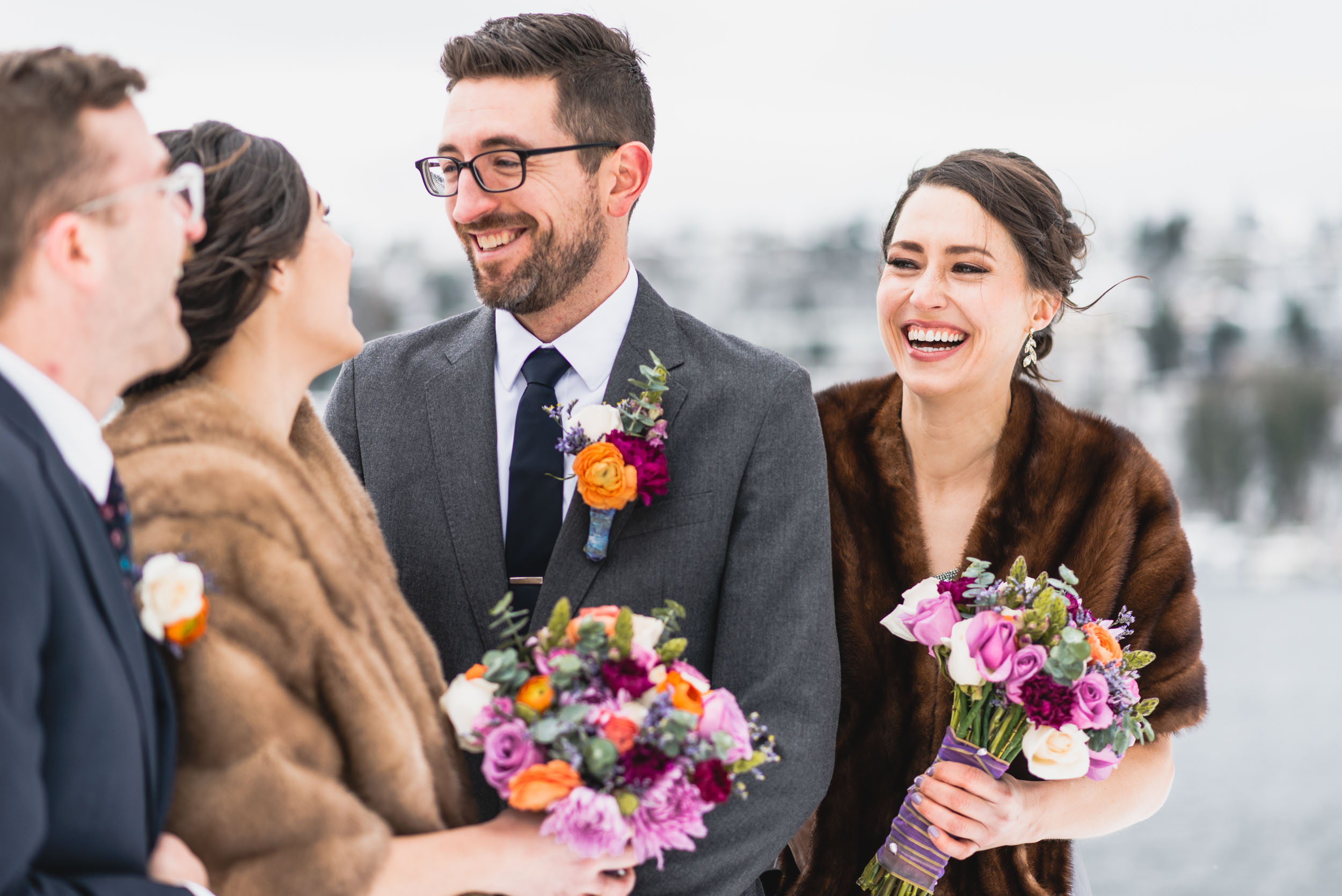 Bridal party laughs together