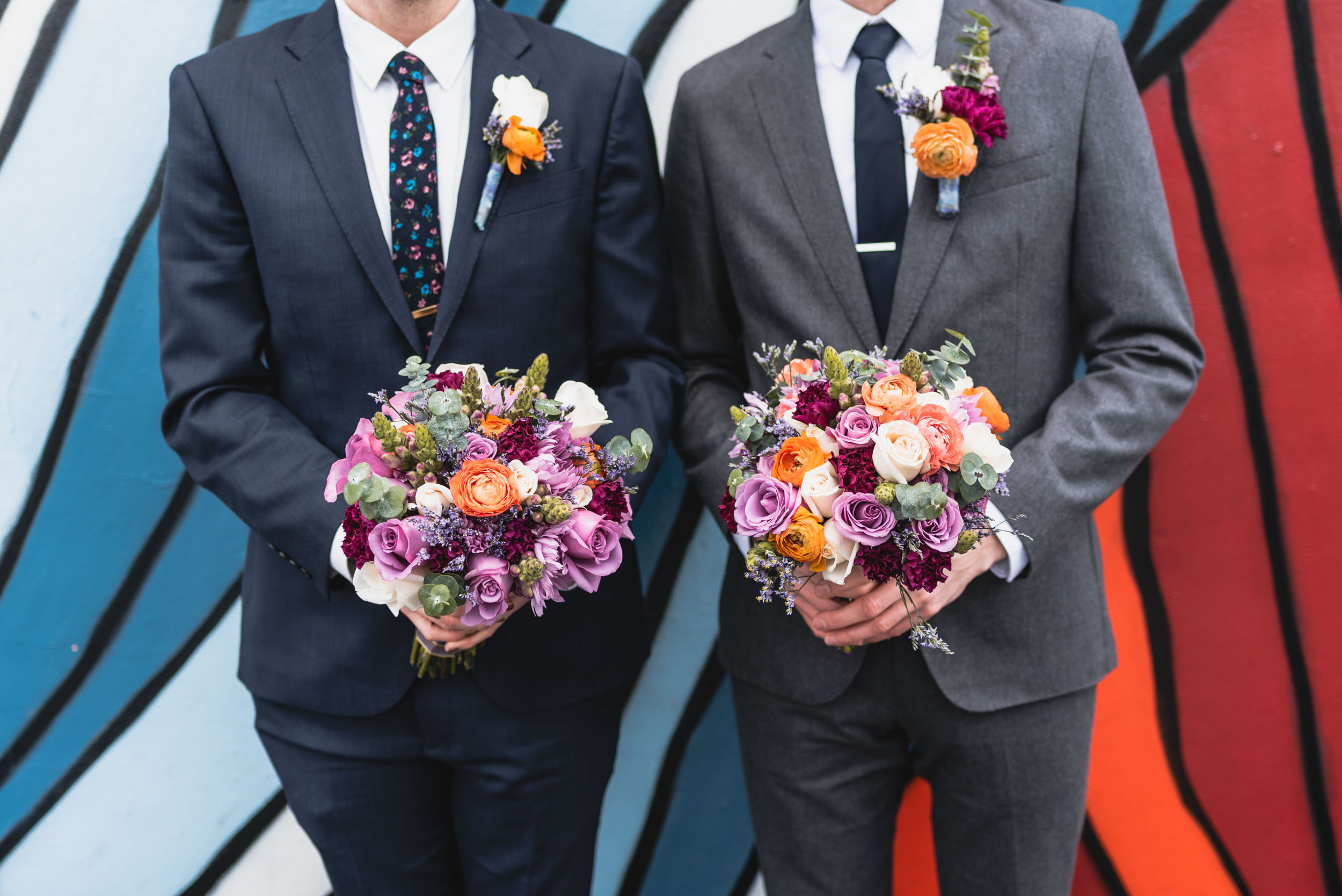 Groom and Best Man hold flowers