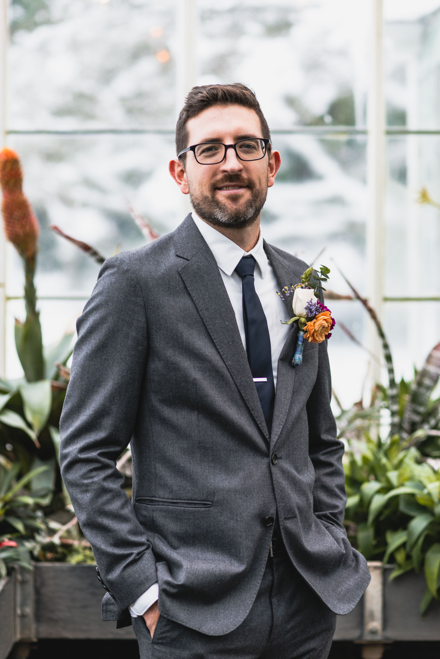 Groom portrait in conservatory