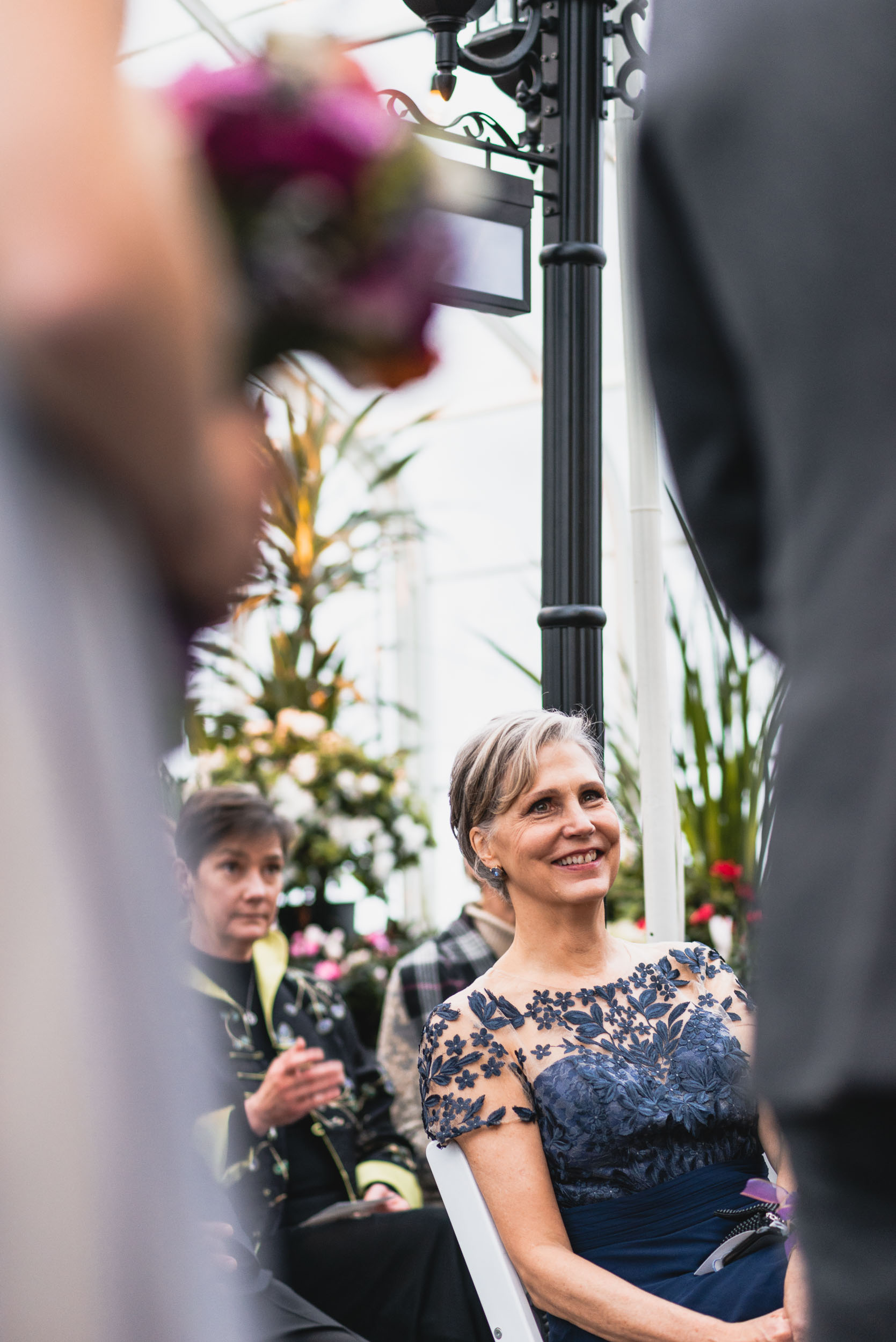 Mother of the Bride smiles during ceremony