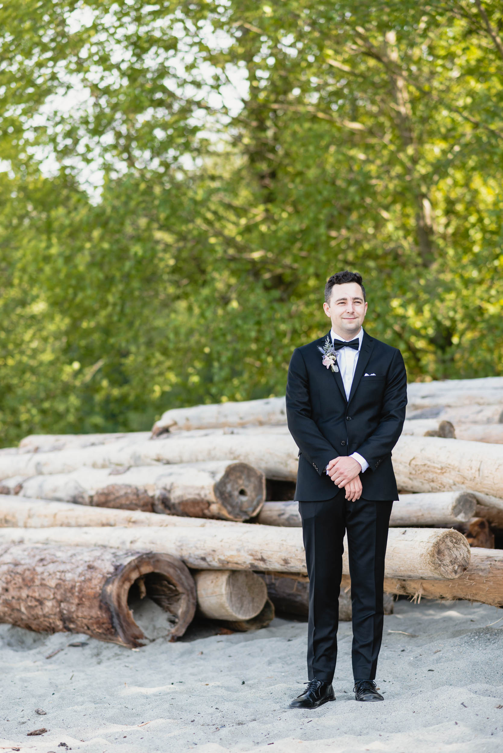 Groom standing at beach