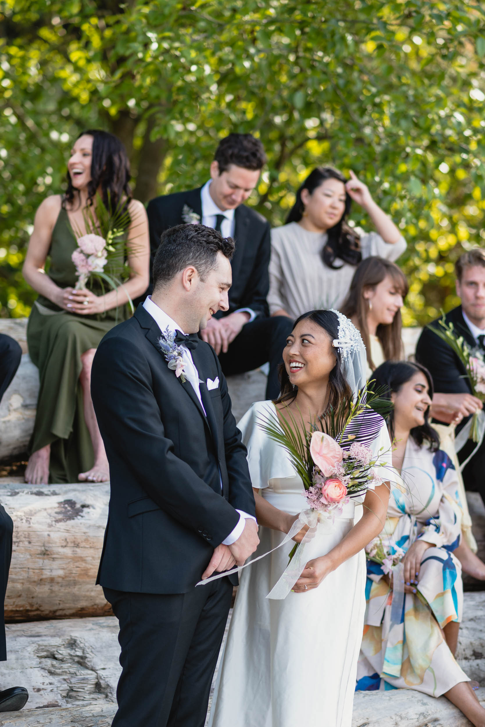 Bridal party at beach with logs