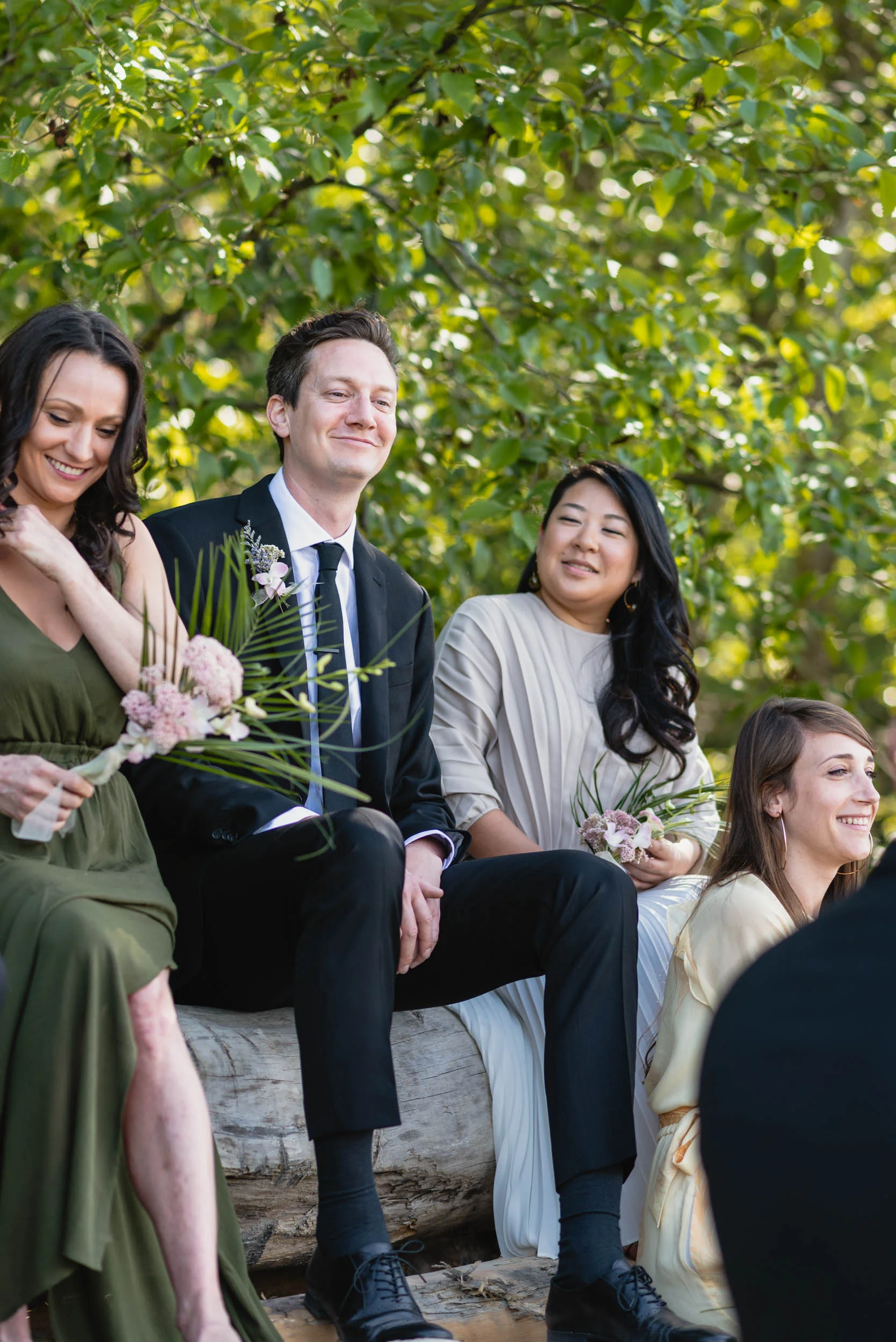Bridal party at beach with logs