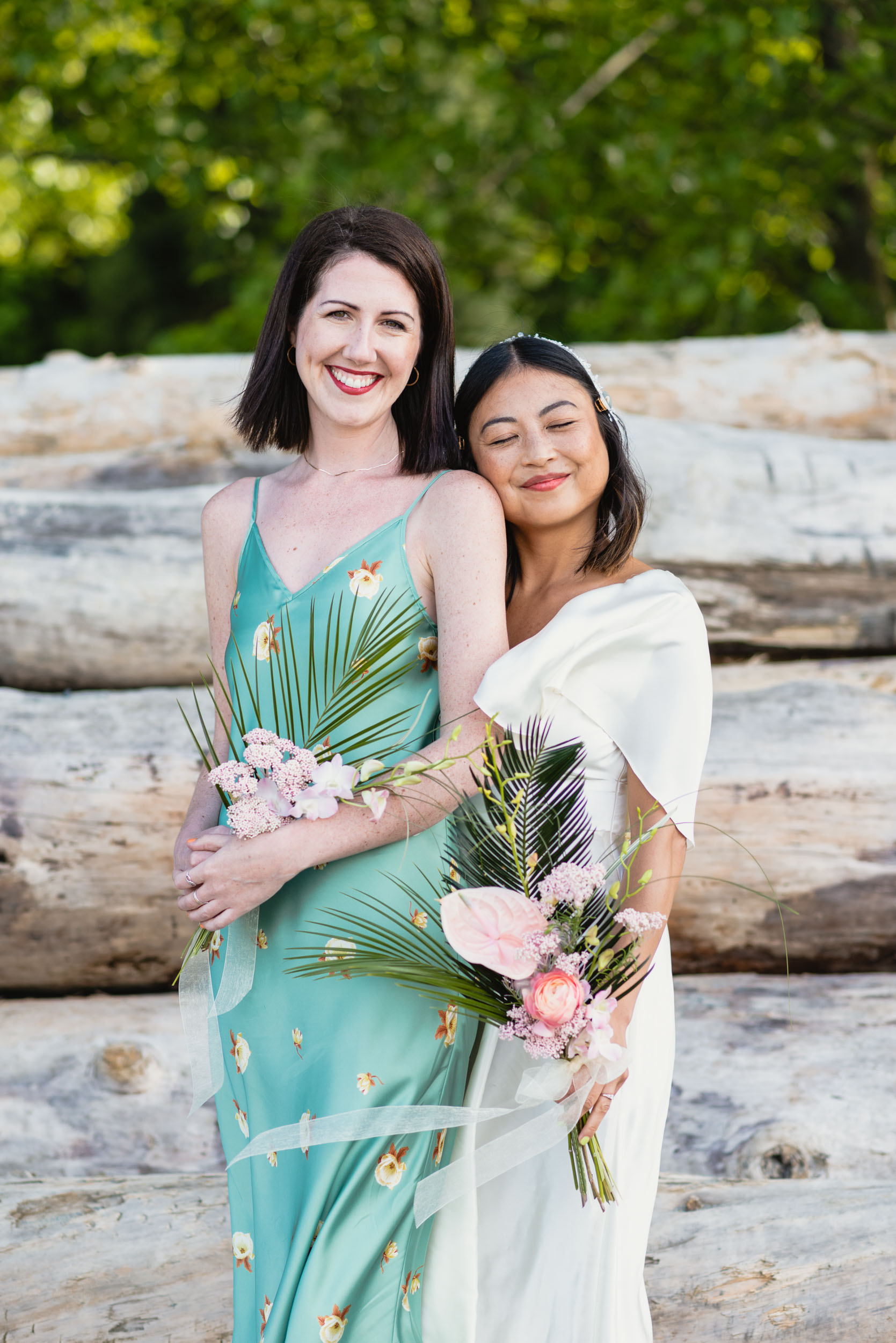 Bride and maid of honour at beach