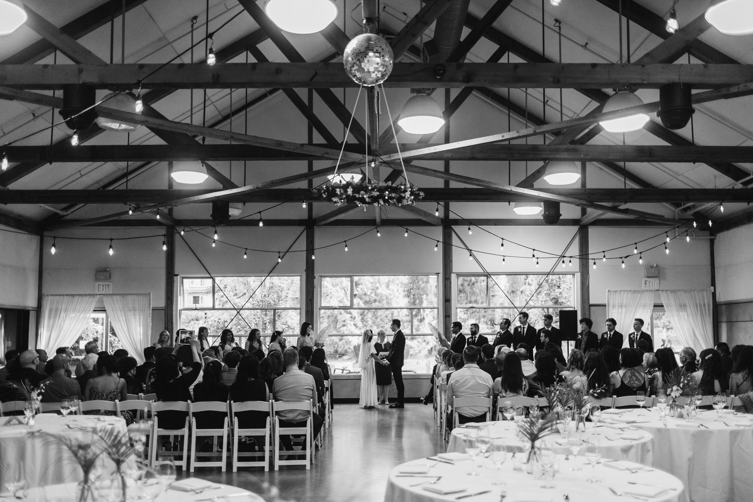 Bride and Groom at ceremony with guests