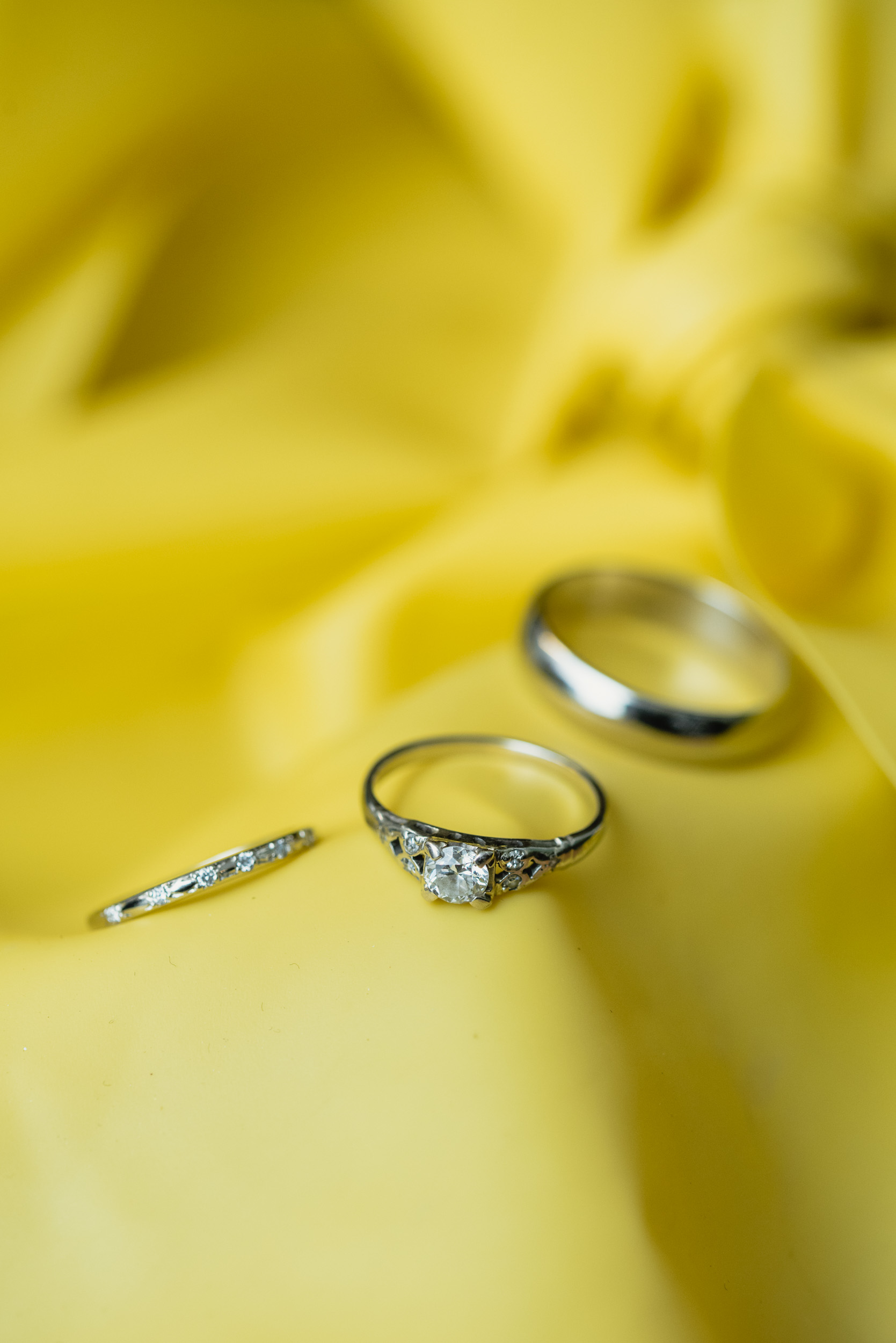 Wedding rings on yellow background