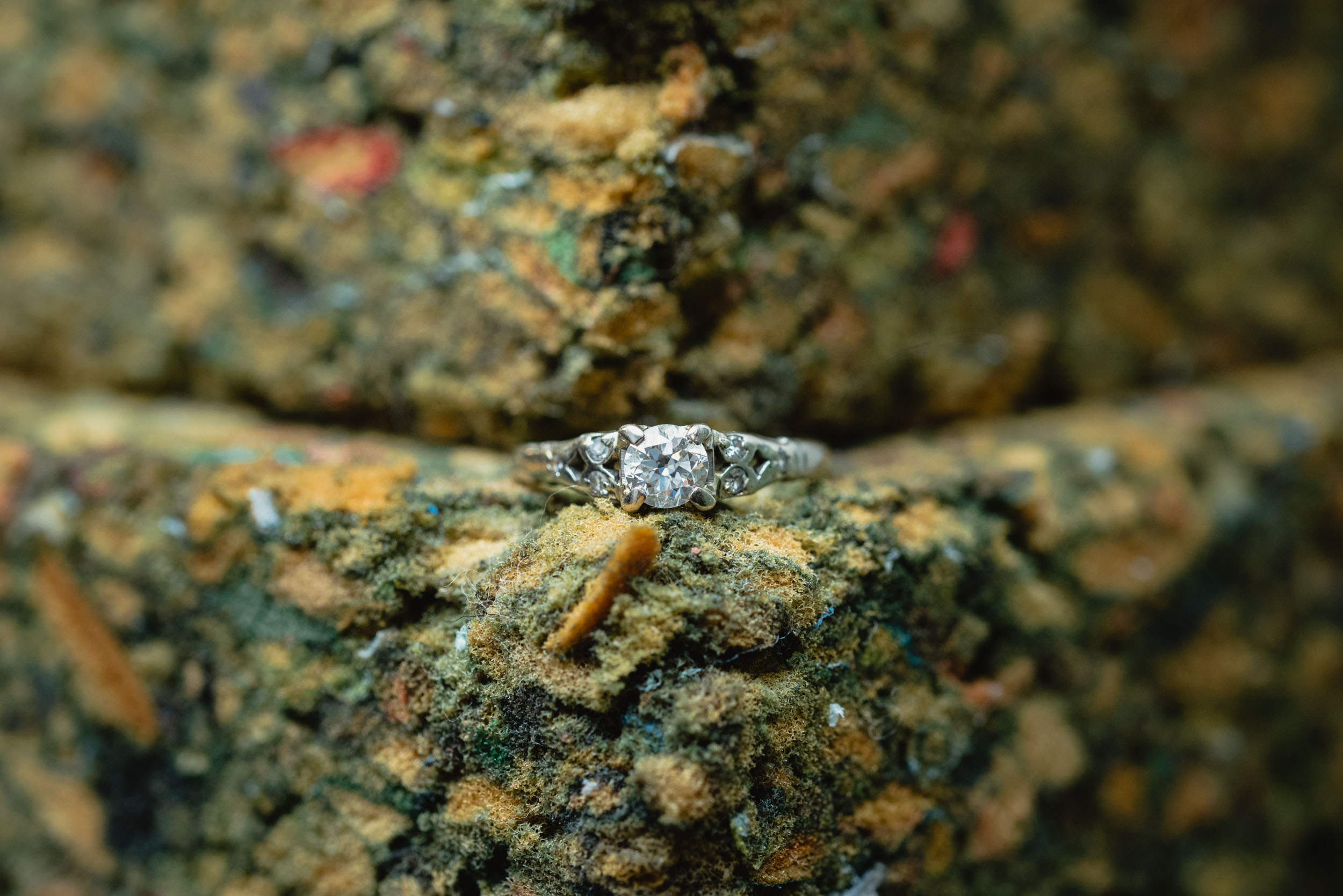 Wedding ring on textured background