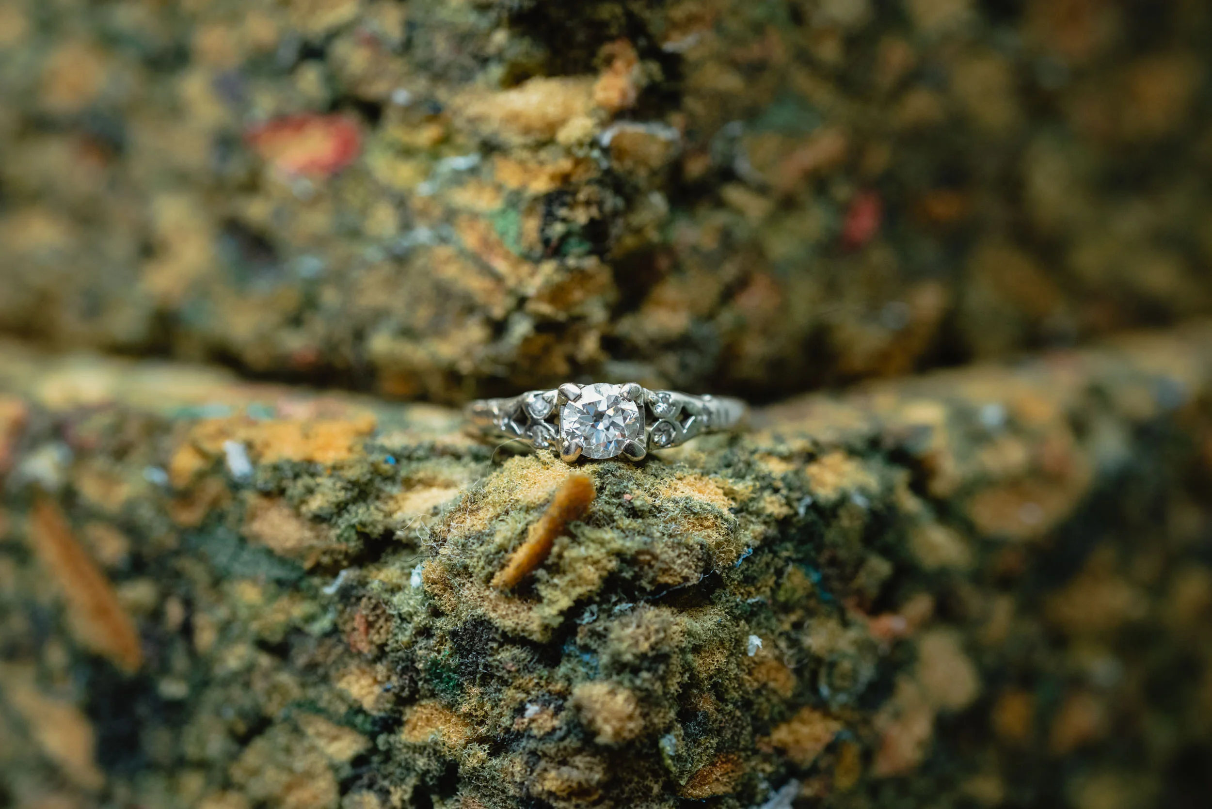 Wedding ring on textured background