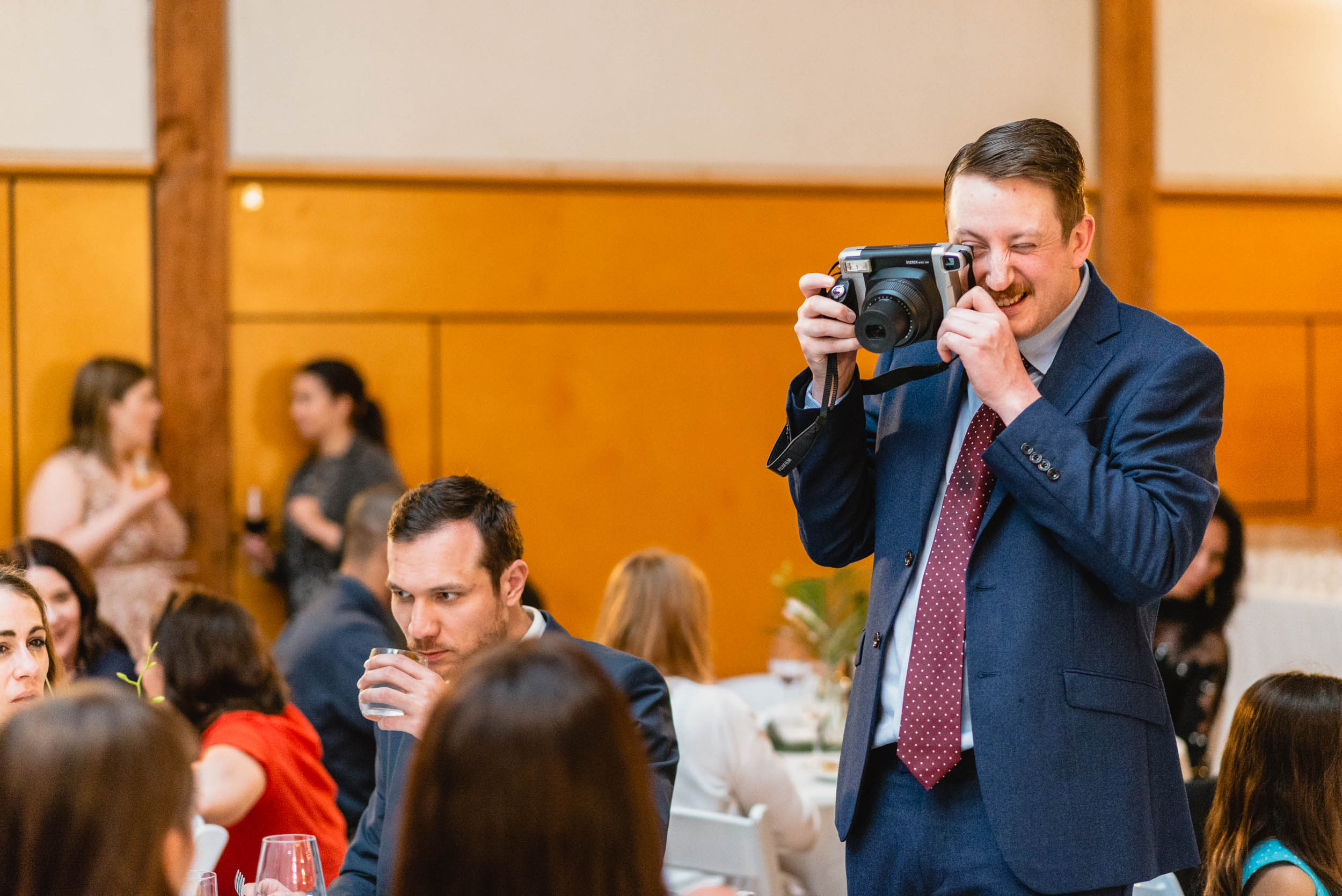 Guest taking a photo with an instant camera