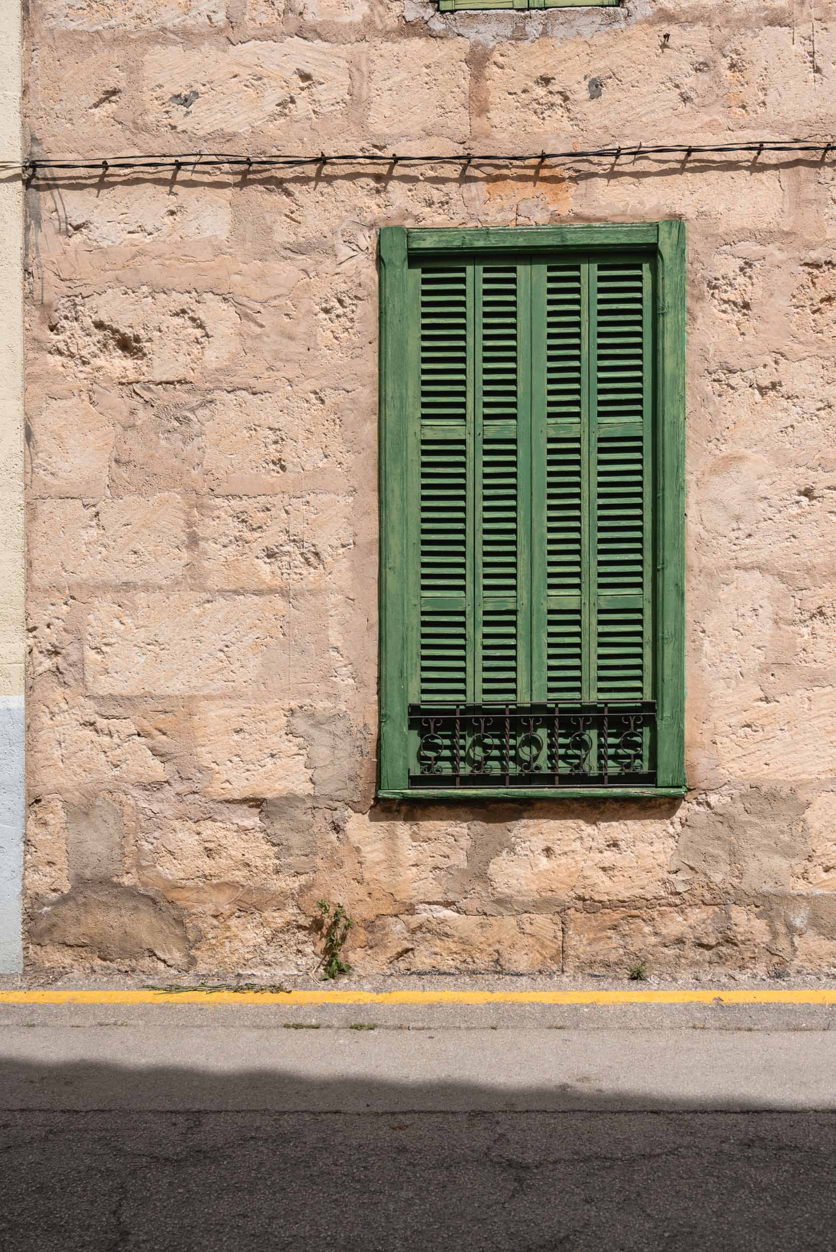Green window in Sineu, Spain