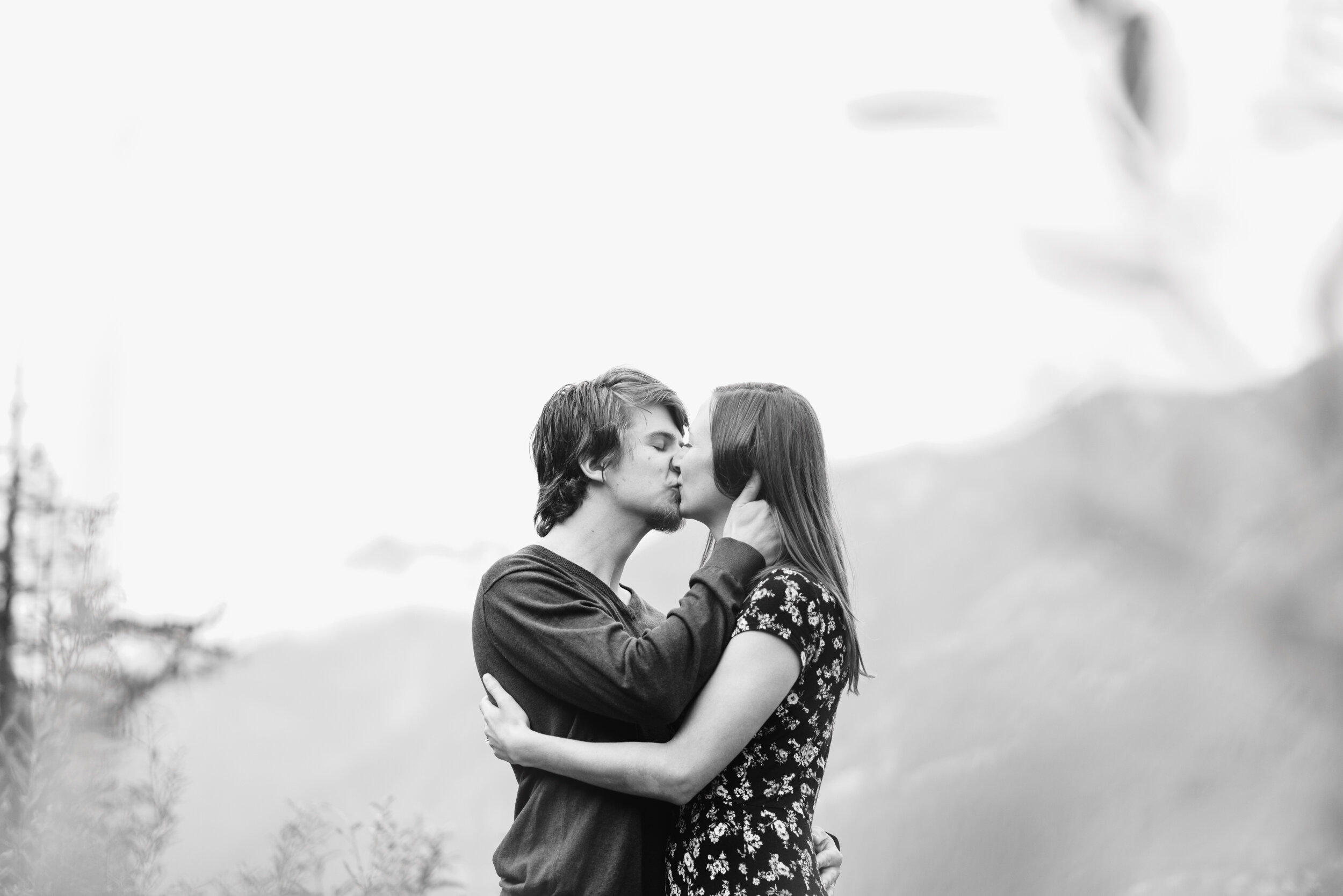 Couple kissing at lakeshore