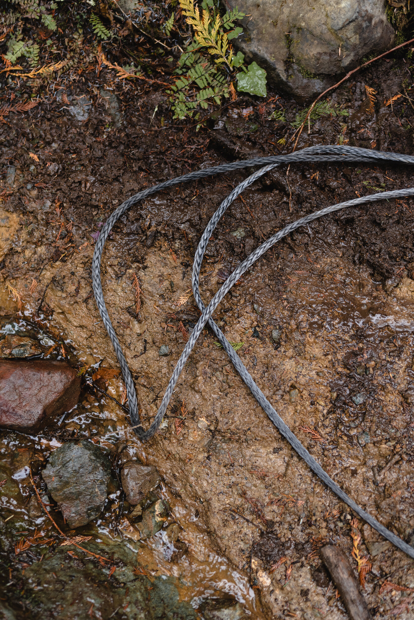 Winch cable on muddy ground