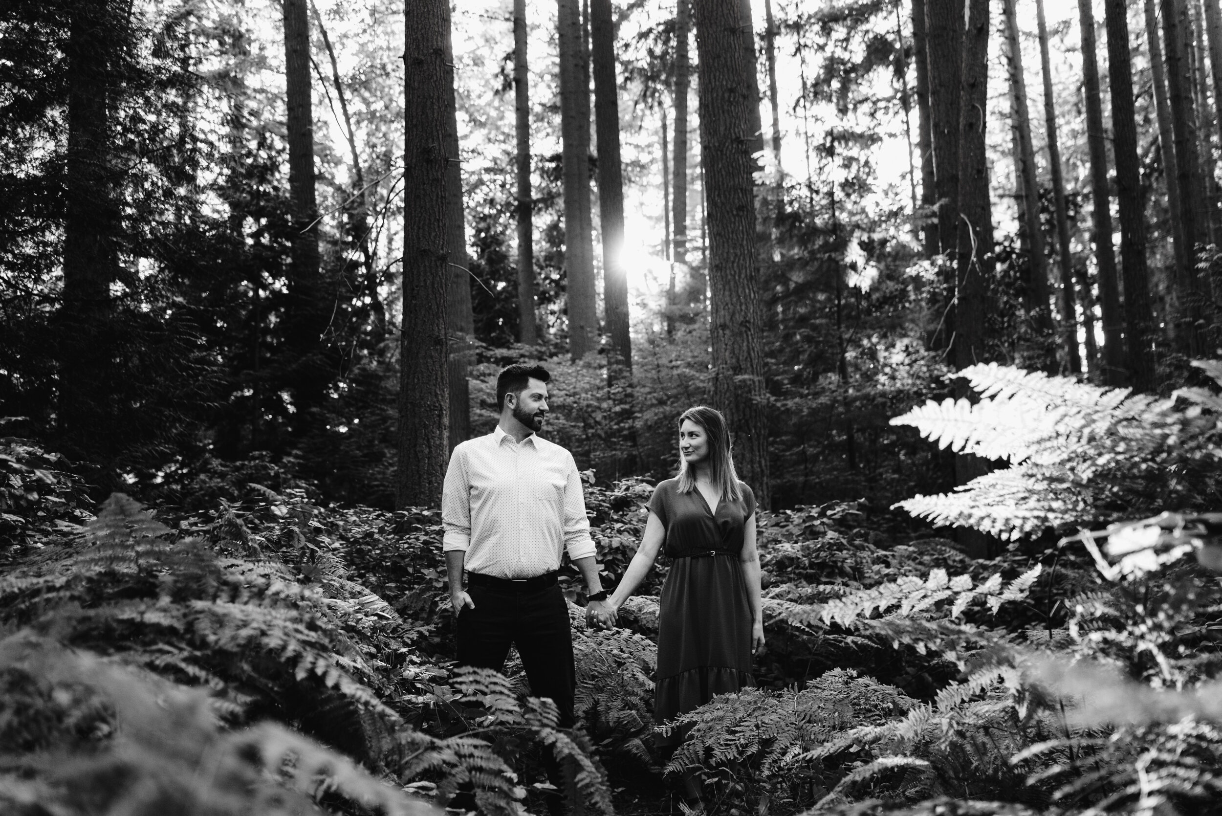 Couple in ferns holding hands