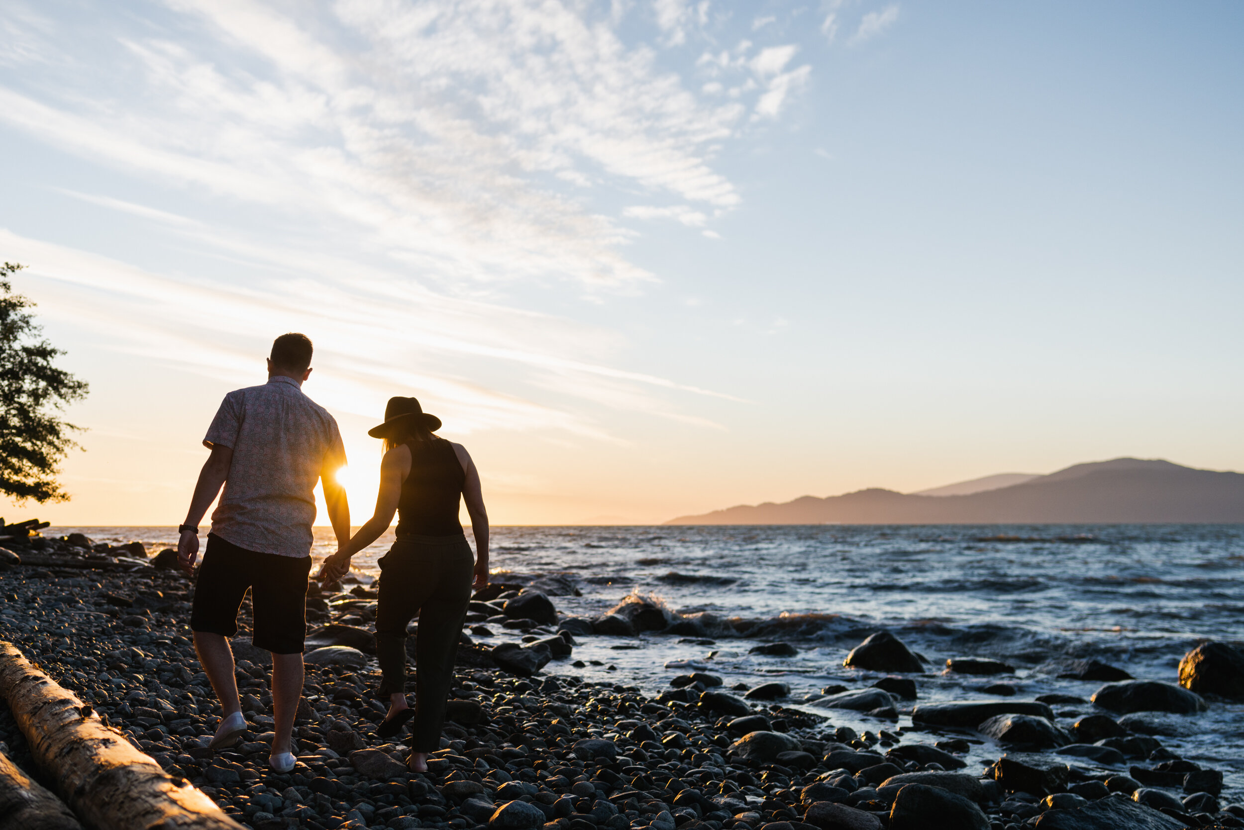 Couple walking on Acadia Beach in sunset