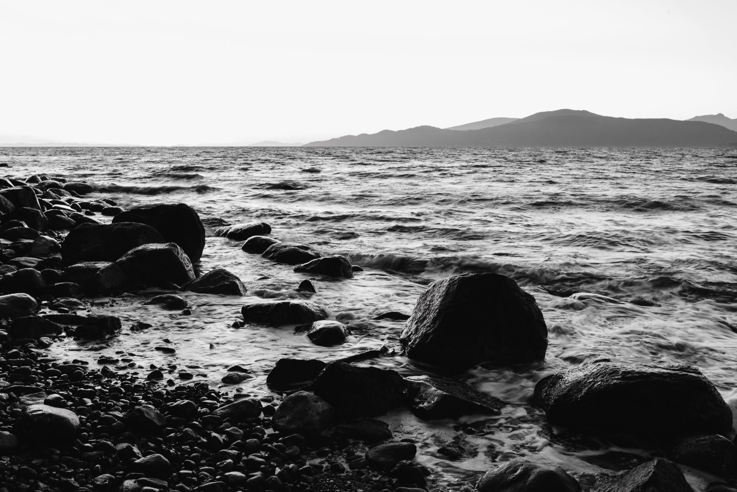 Black and white ocean shore