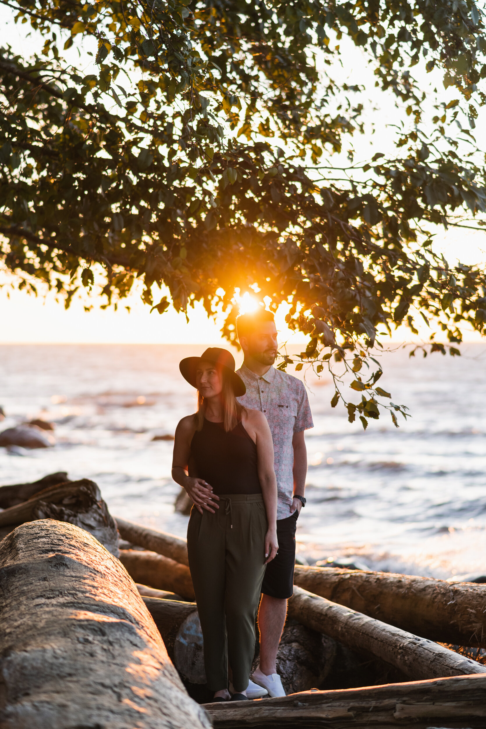 Couple standing in sunset at Acadia Beach