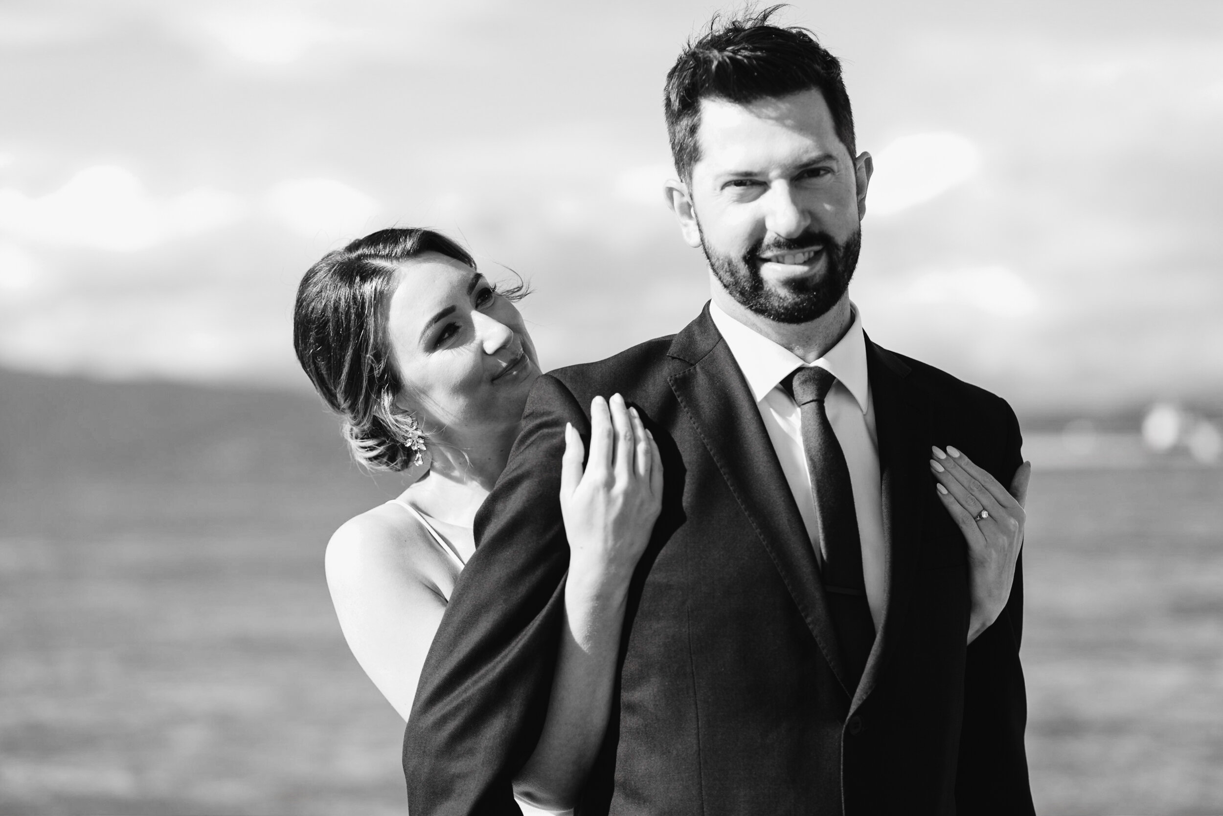 Couple at beach black and white hug